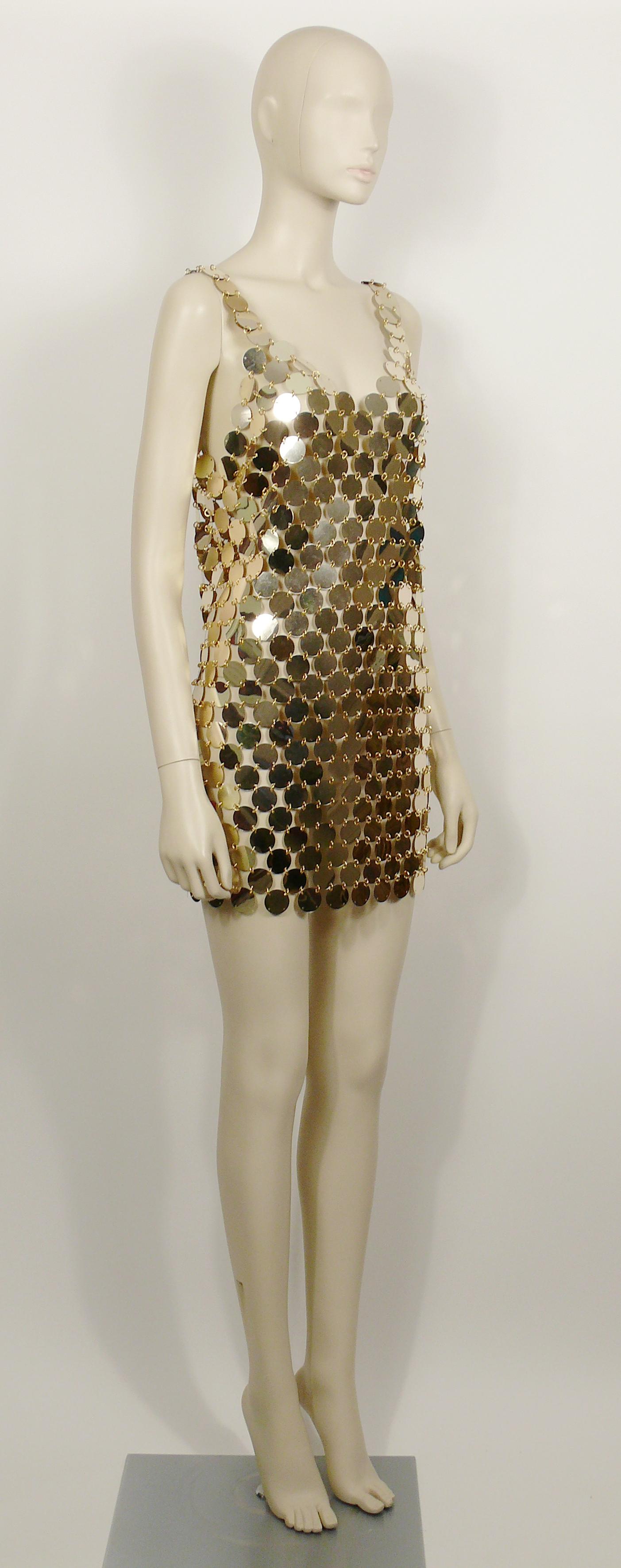 PACO RABANNE vintage DIY rhodoid disc mini dress from 1996, rare and collectable example of a re-issued of the iconic 1966 PACO RABANNE dress (photographied on the cover of the British Vogue - May 1966).

This dress is made of hundreds of pale gold