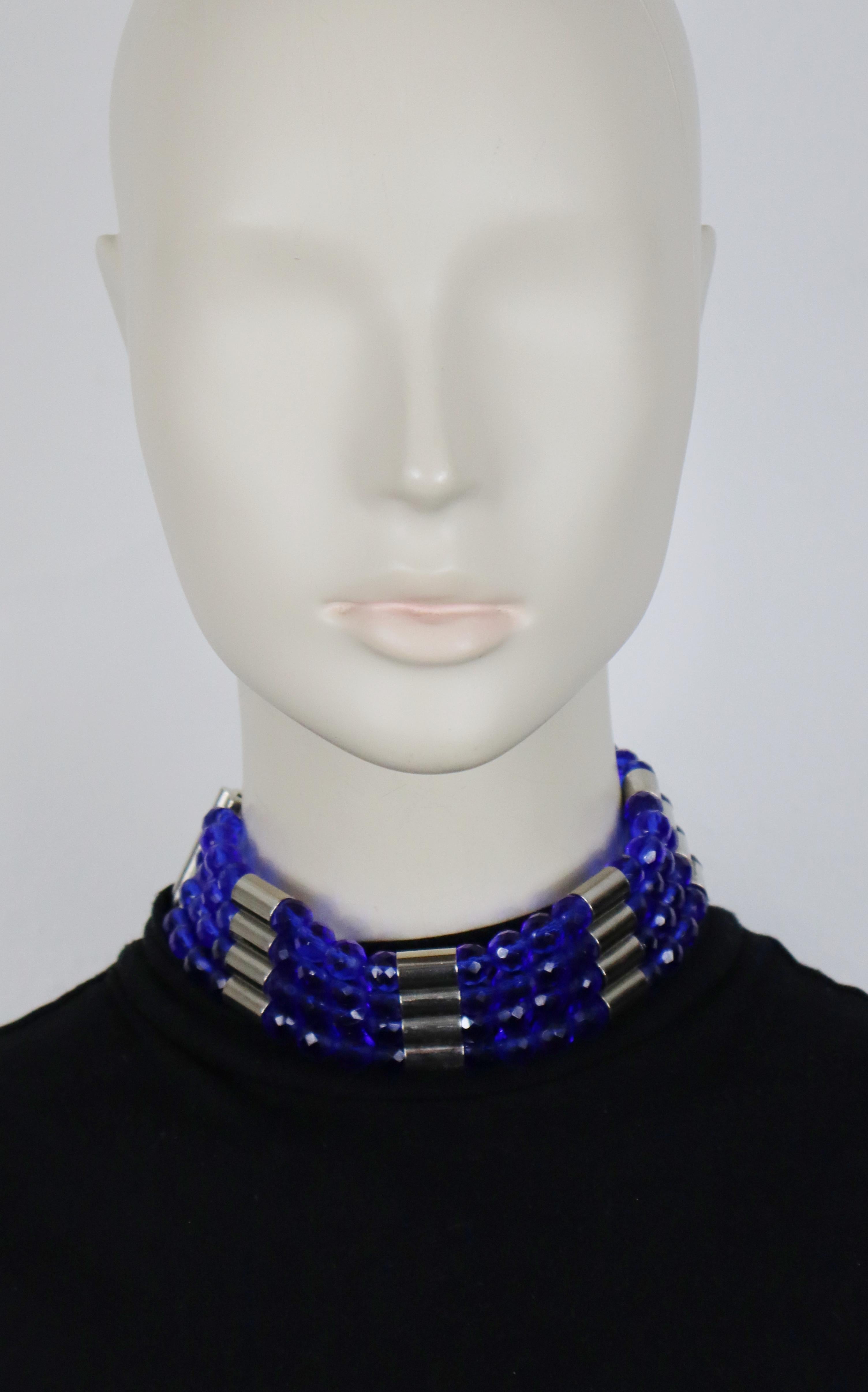 PACO RABANNE vintage choker necklace featuring four strands of electric blue facetted glass beads alterning with tubular silver tone elements.

Lobster clasp closure.

Marked PACO RABANNE Paris.

Indicative measurements : length approx. 36 cm (14.17