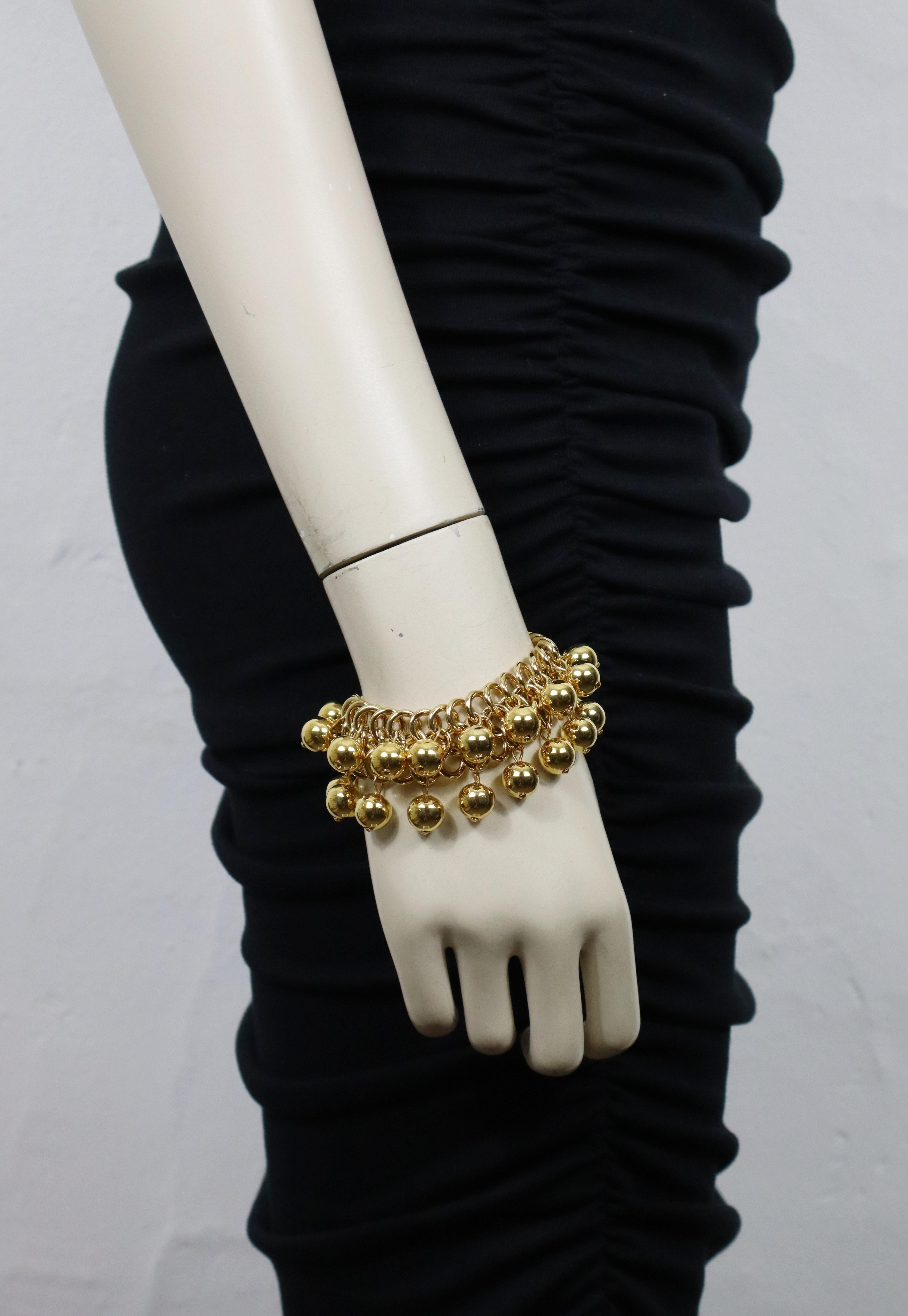 PACO RABANNE vintage gold tone link bracelet featuring ball charms.

Embossed PACO RABANNE.

Indicative measurements : length approx. 18.5 cm (7.28 inches) / max. width approx. 2 cm (0.79 inch).

Material(s) : Gold tone metal hardware.

NOTES
- This