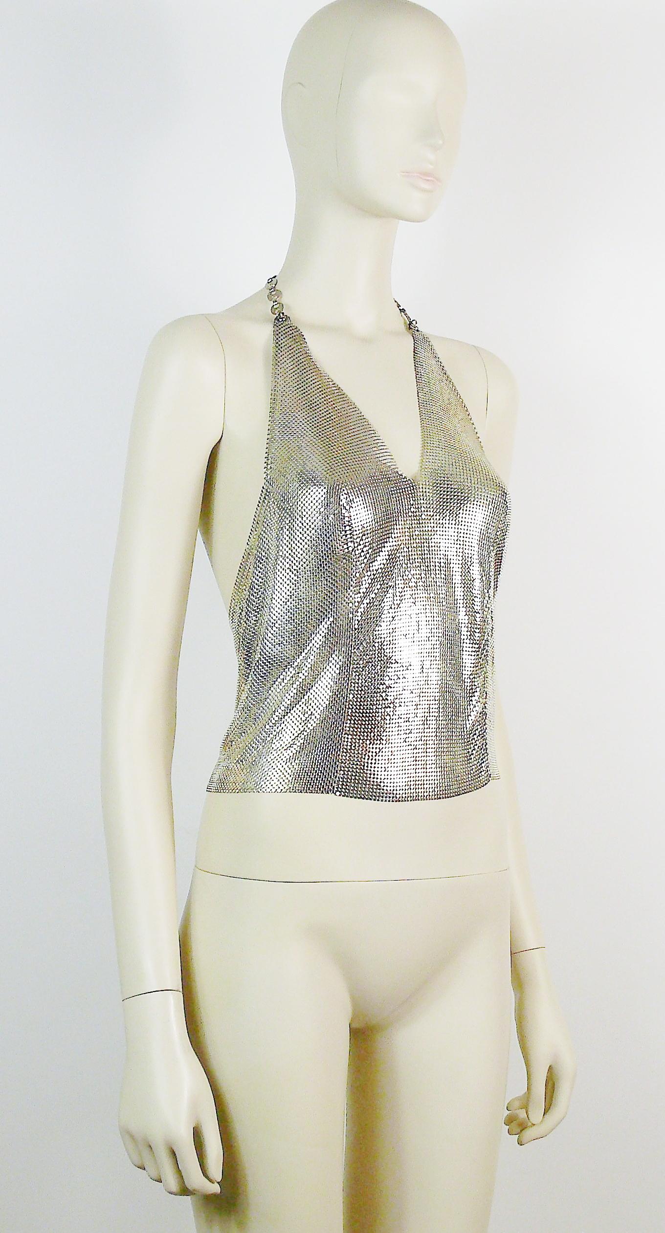 PACO RABANNE vintage polished silver toned metal mesh iconic backless top.

Adjustable size (extension chains).
Lobster clasps closure.

Metal tag embossed PACO RABANNE Paris.

Photographied on a XS mannequin.
This top will fit XS to S