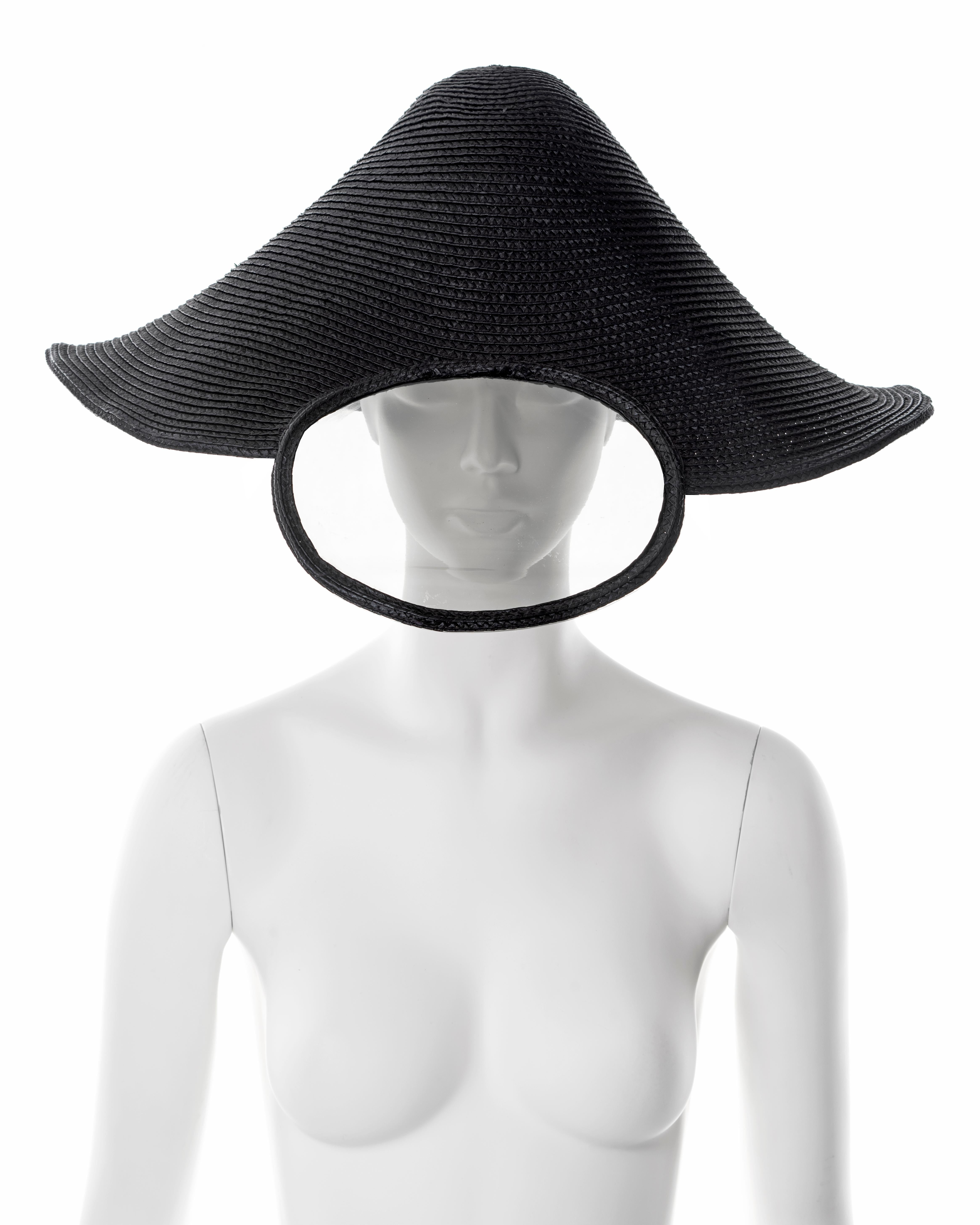 ▪ Paco Rabona x Regis showpiece hat
▪ Sold by One of a Kind Archive
▪ Haute Couture, Spring-Summer 1994
▪ Constructed from black straw
▪ Integrated clear vinyl visor 
▪ Sample
▪ Made in France

All photographs in this listing EXCLUDING any reference