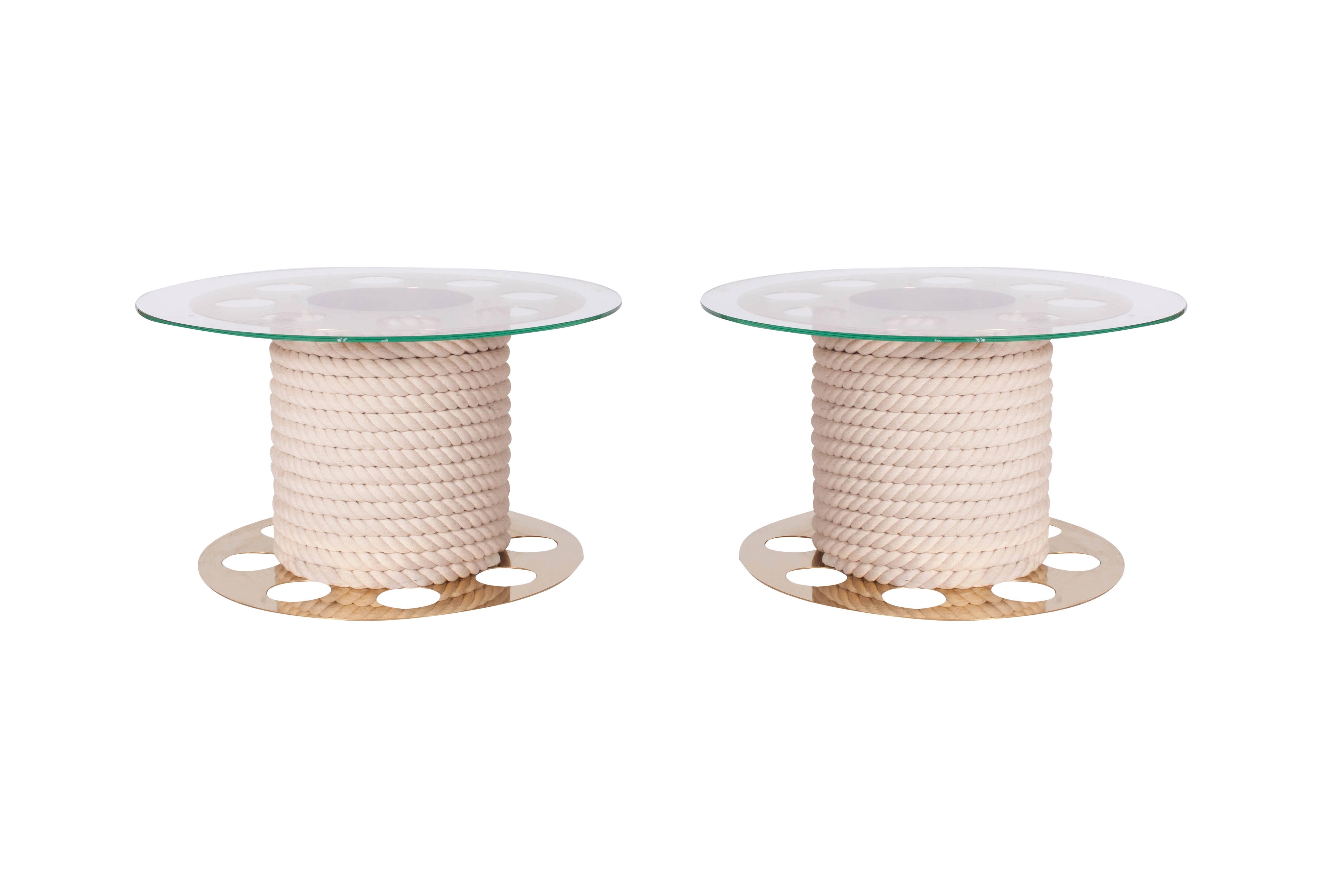 Mid-century modern decorative pair of round side tables in brass, rope and glass top,
by fashion designer Paco Rabanne, France 1980s

Both tables are signed with a Paco Rabanne label.