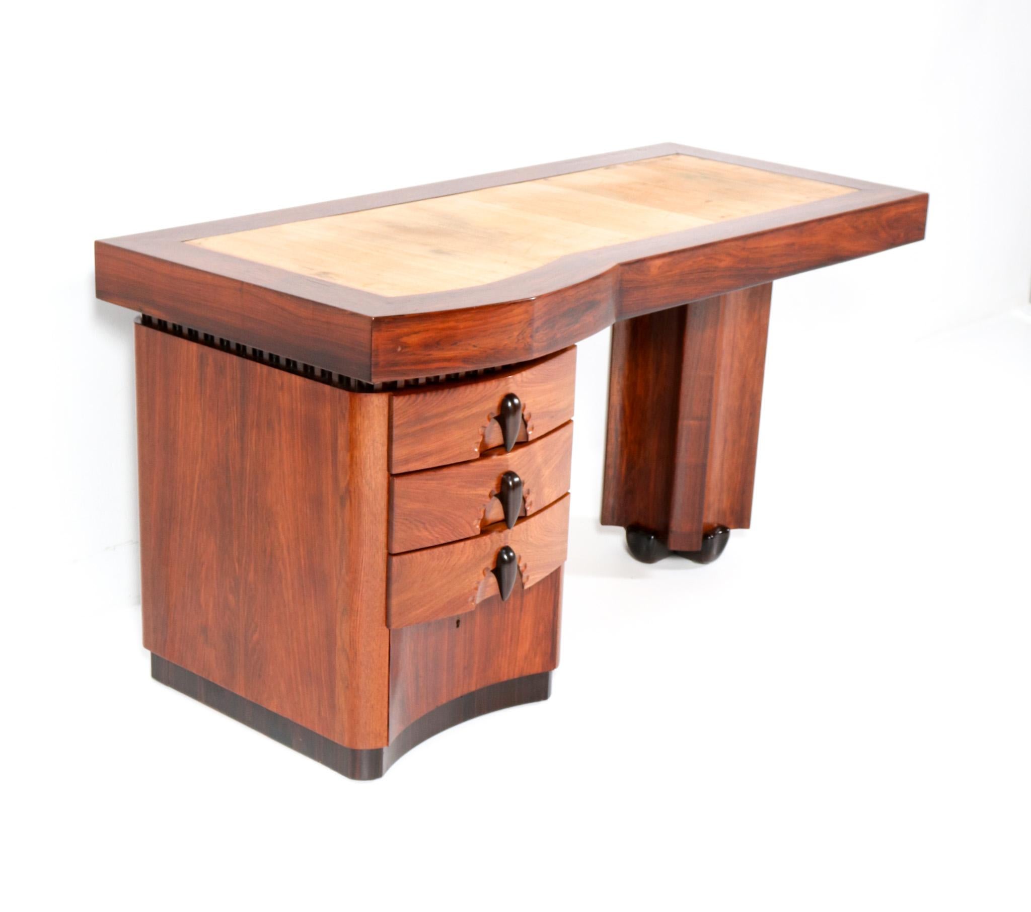 Magnificent and ultra rare Art Deco Amsterdamse School desk or writing table.
Design by F.A. Warners.
Striking Dutch design from the 1920s.
Solid padouk  and original padouk veneer base on stylish solid macassar ebony feet.
Four original drawers