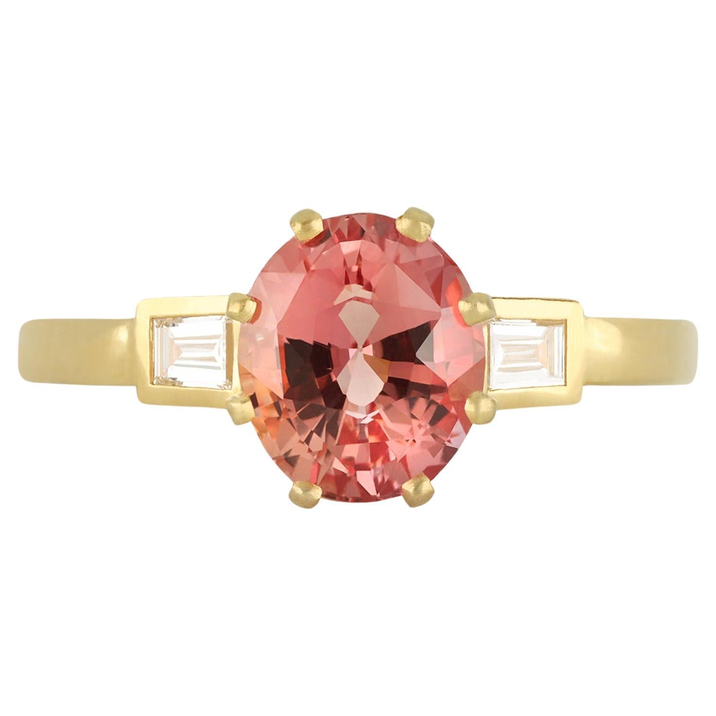 Padparadscha sapphire and diamond flanked solitaire ring, circa 1990.