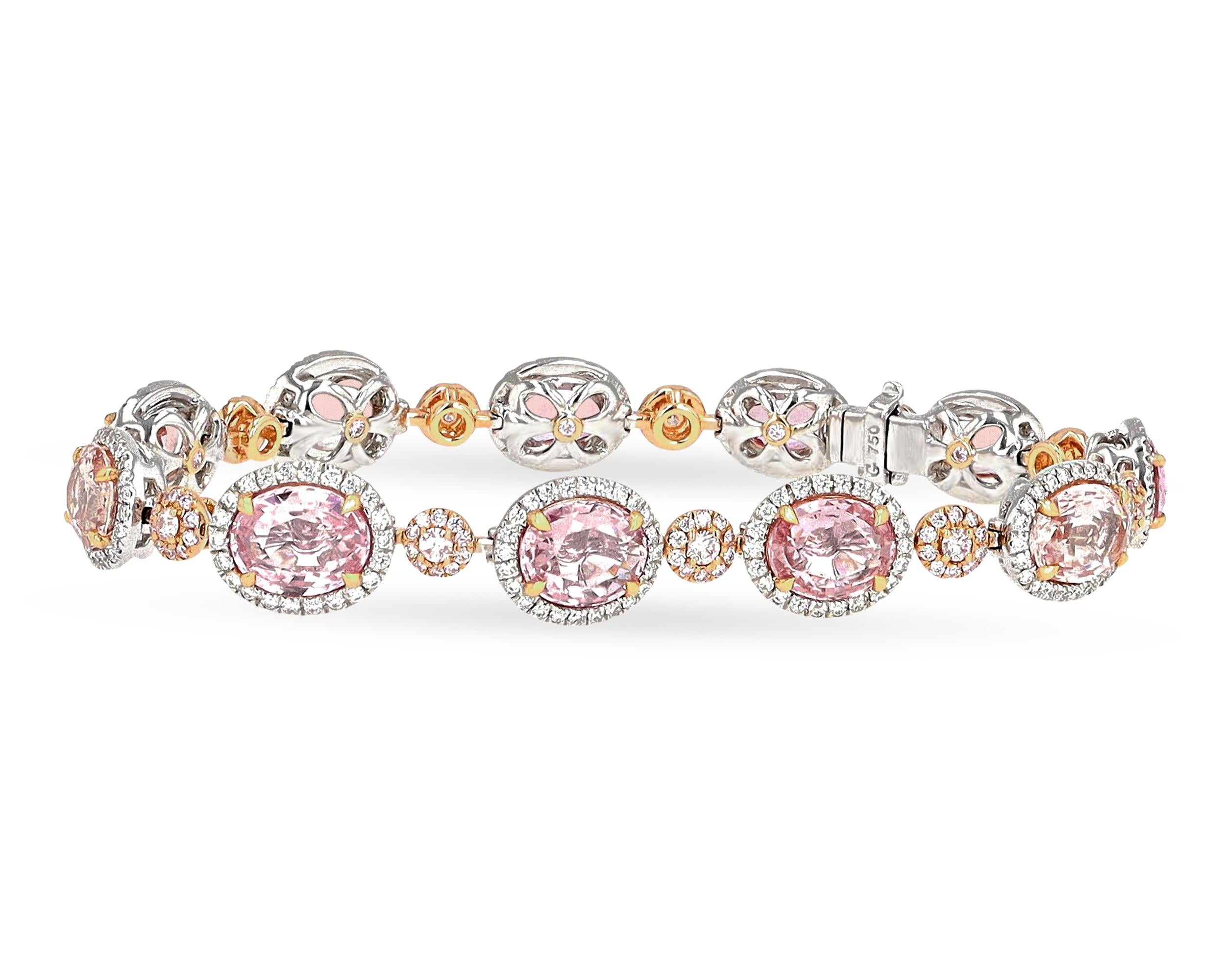 Eleven of the rarest of all sapphires - the padparadscha sapphire - dazzle in this dramatic bracelet. Totaling 16.48 carats, the gems exhibit the superb pastel orangy-pink color that makes these stones so highly coveted. The sapphires are certified