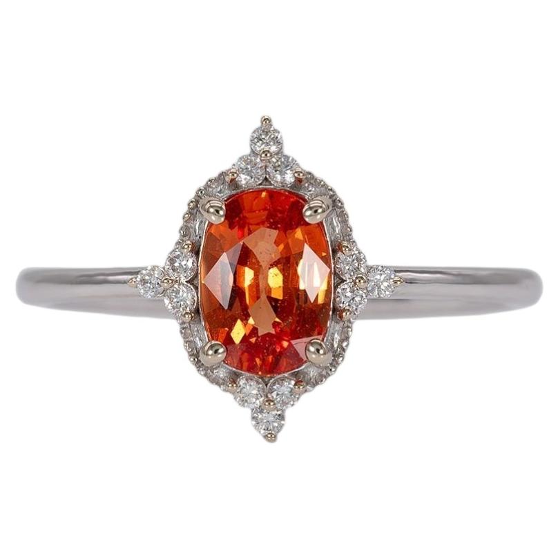 Bague « halo » en saphir padparadscha rehaussée de diamants naturels, en or massif 14 carats