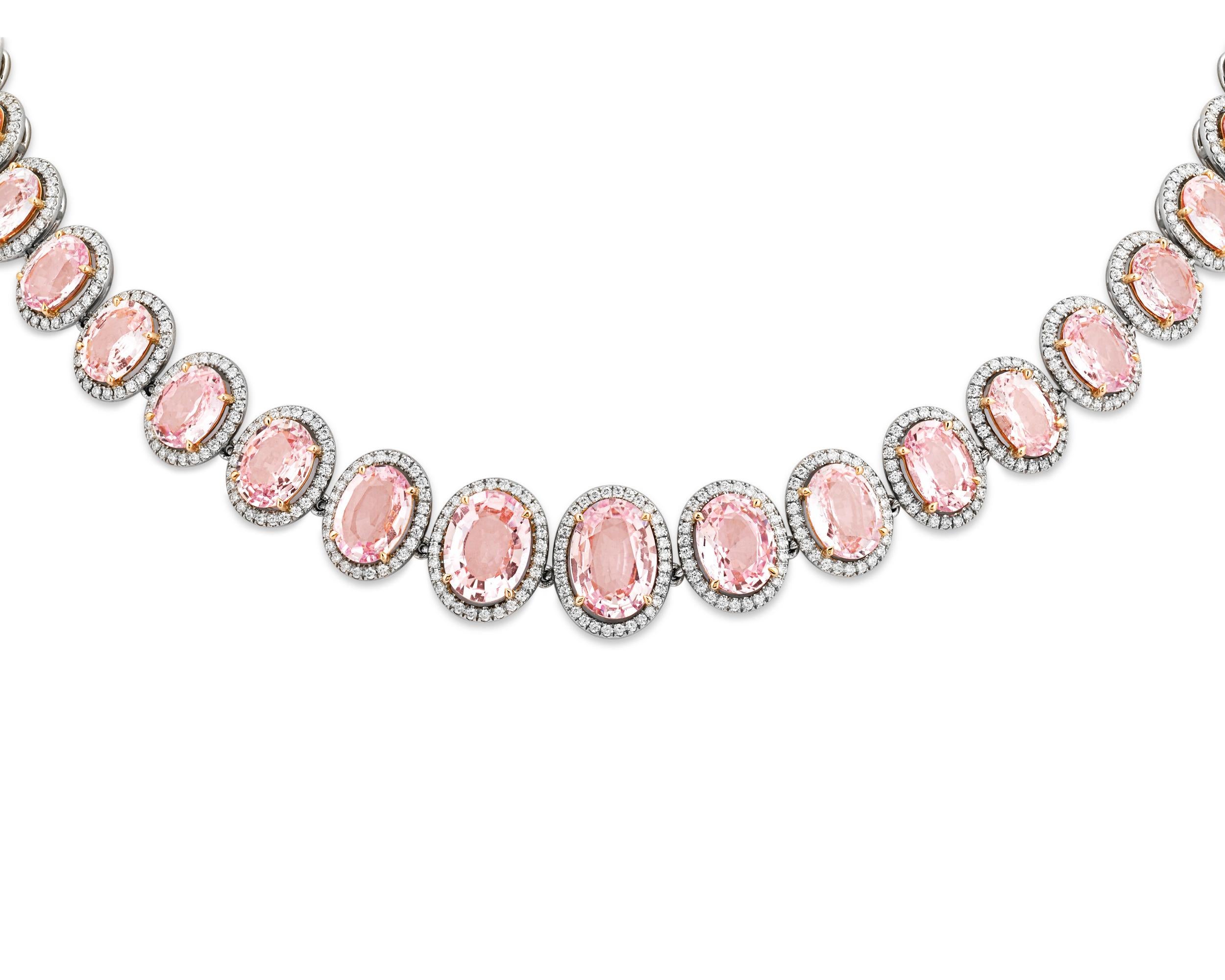 Forty-one of the rarest of all sapphires - the Padparadscha sapphire - dazzle in this dramatic necklace. Totaling 58.31 carats, the gems exhibit the superb pastel orangy-pink color that makes these stones so highly coveted. The sapphires are