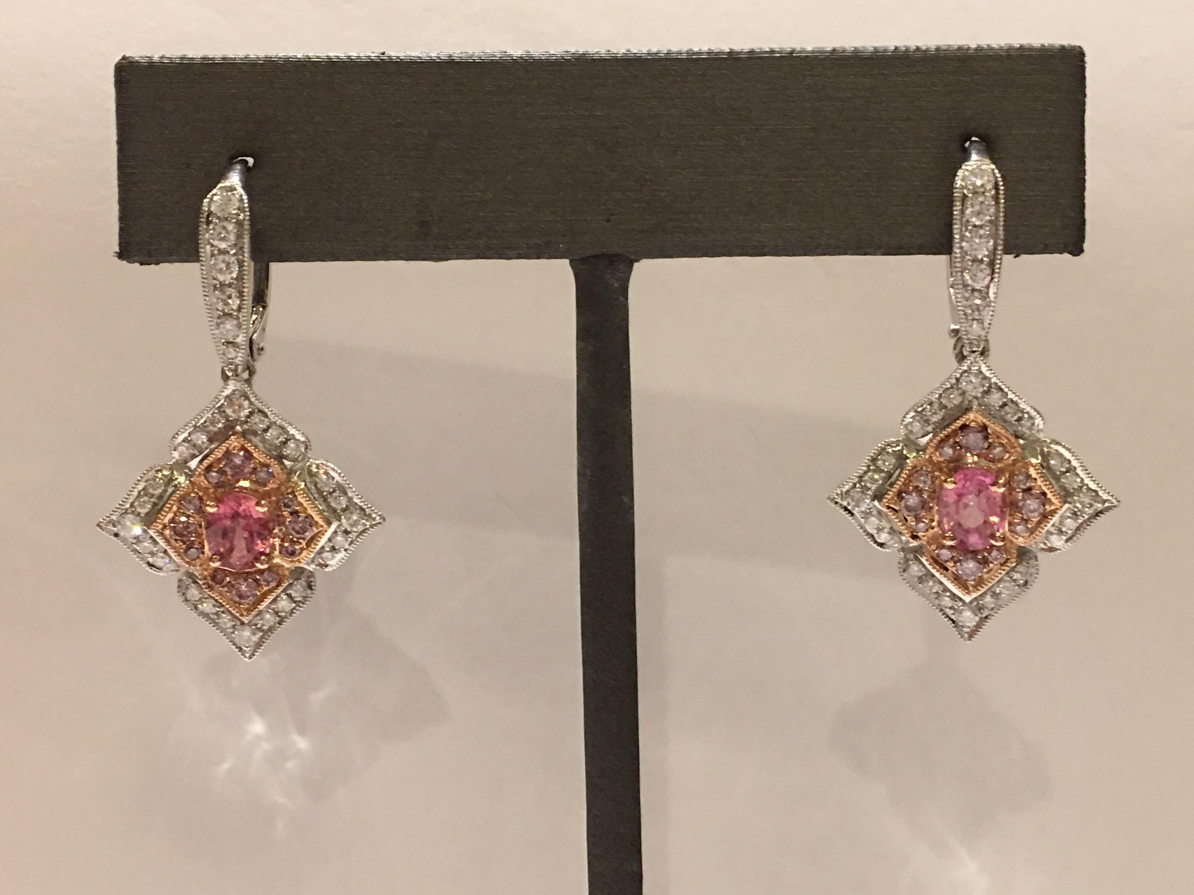 Padparadscha Sapphire with Pink and white Diamond is one of a kind Earring set in 14K Two Tone Gold.
The Padparadscha Total weight is 0.75 Carat , Pink Diamond is 0.33 Carat and White Round Diamond is 0.66 Carat,
Total Diamond and Sapphire weight is