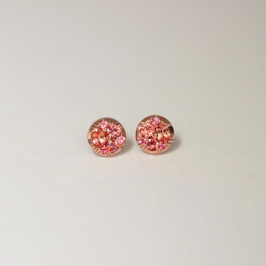 Handcrafted in Belgium, by jewellery designer Joke Quick, without any casting or printing, these 18 K Rose gold stud earrings display  rare Padparadscha sapphires and rare vibrant pink spinels. 

Each gem is handpicked and placed with precision,