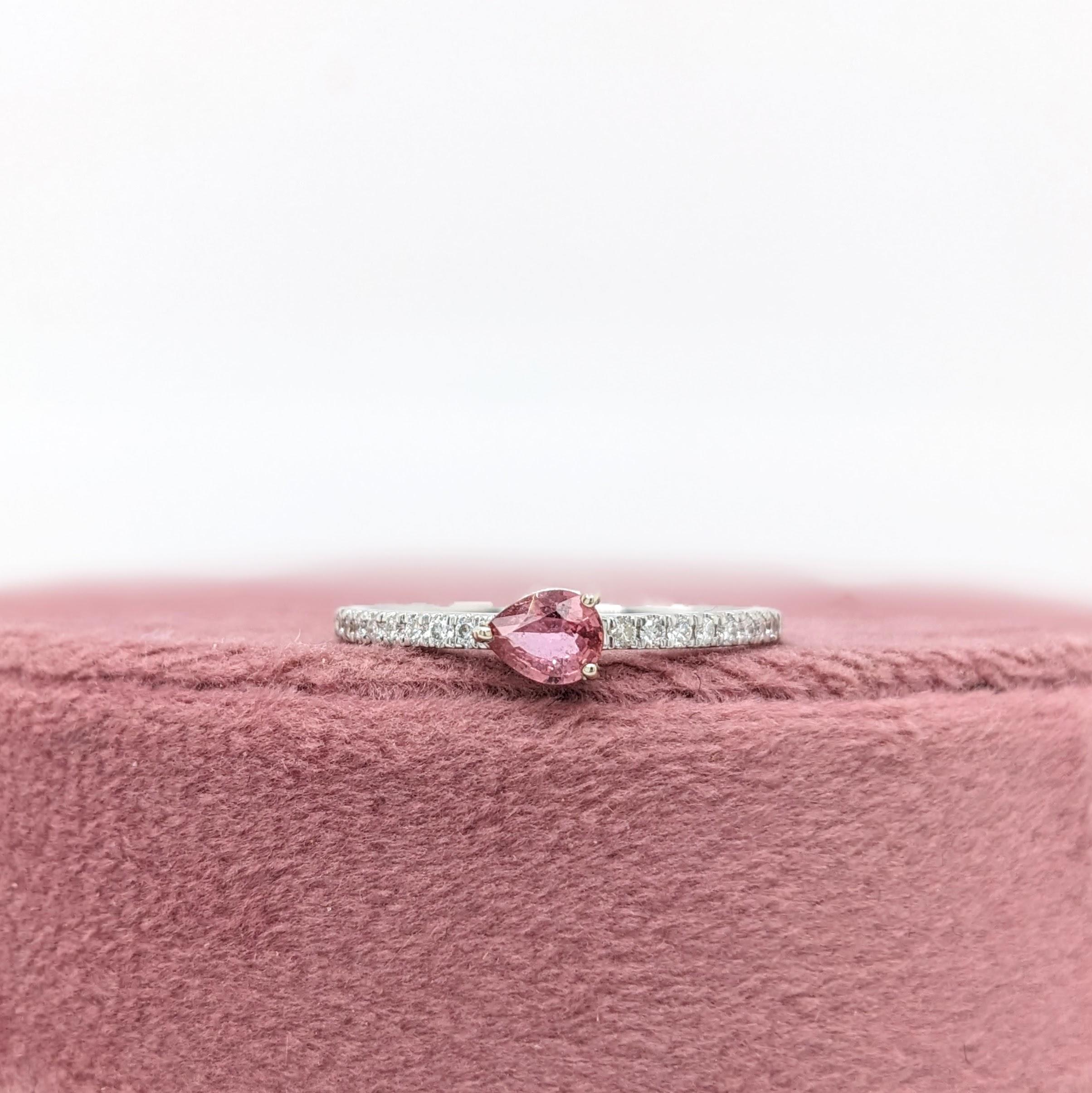 This beautiful ring features a 0.32 carat pear shaped Padparadscha Sapphire gemstone with natural earth mined diamonds set in solid 14K gold. This Padparadscha Sapphire ring makes a lovely September birthstone gift for your loved ones!