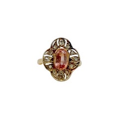 Anello Padparadschah con zaffiro ovale di circa 1,10 carati, diamante e 14 carati