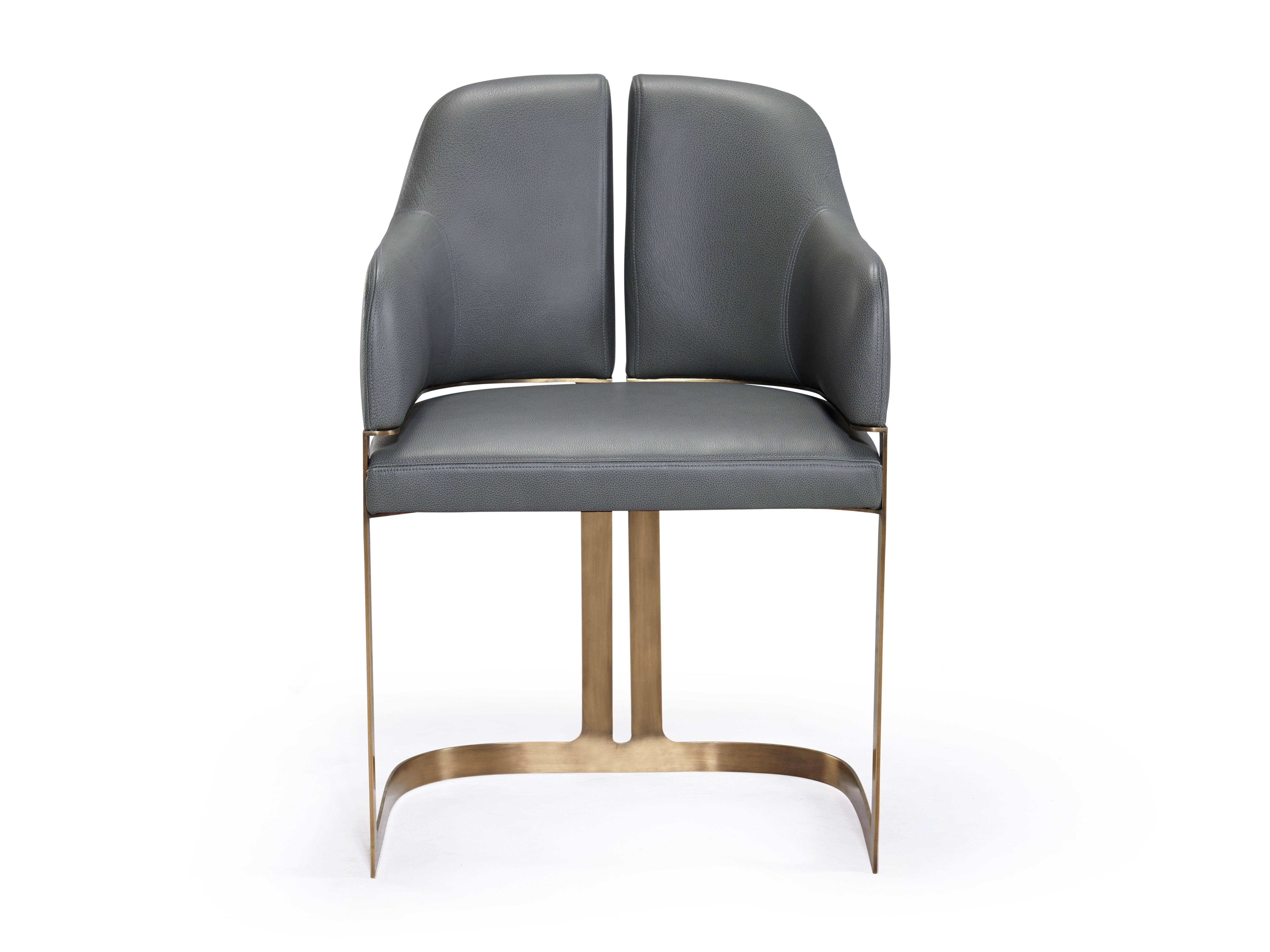 Padus dining and host chair are a graceful, contemporary nod to Art Moderne. A refined curvilinear metal base majestically elevates and defines the upholstered seat and back which similarly echoes the vertical reveal of the base. Available both with