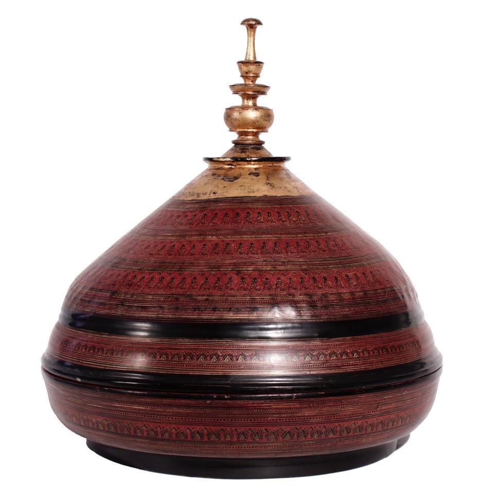 Pagan Daung-baung, an unusual incised lacquer temple food offering tray and cover.  The conical cover having a spire finial, red and black lacquer layers with gold leaf over a basket weave base.  The detailed incised decoration of concentric