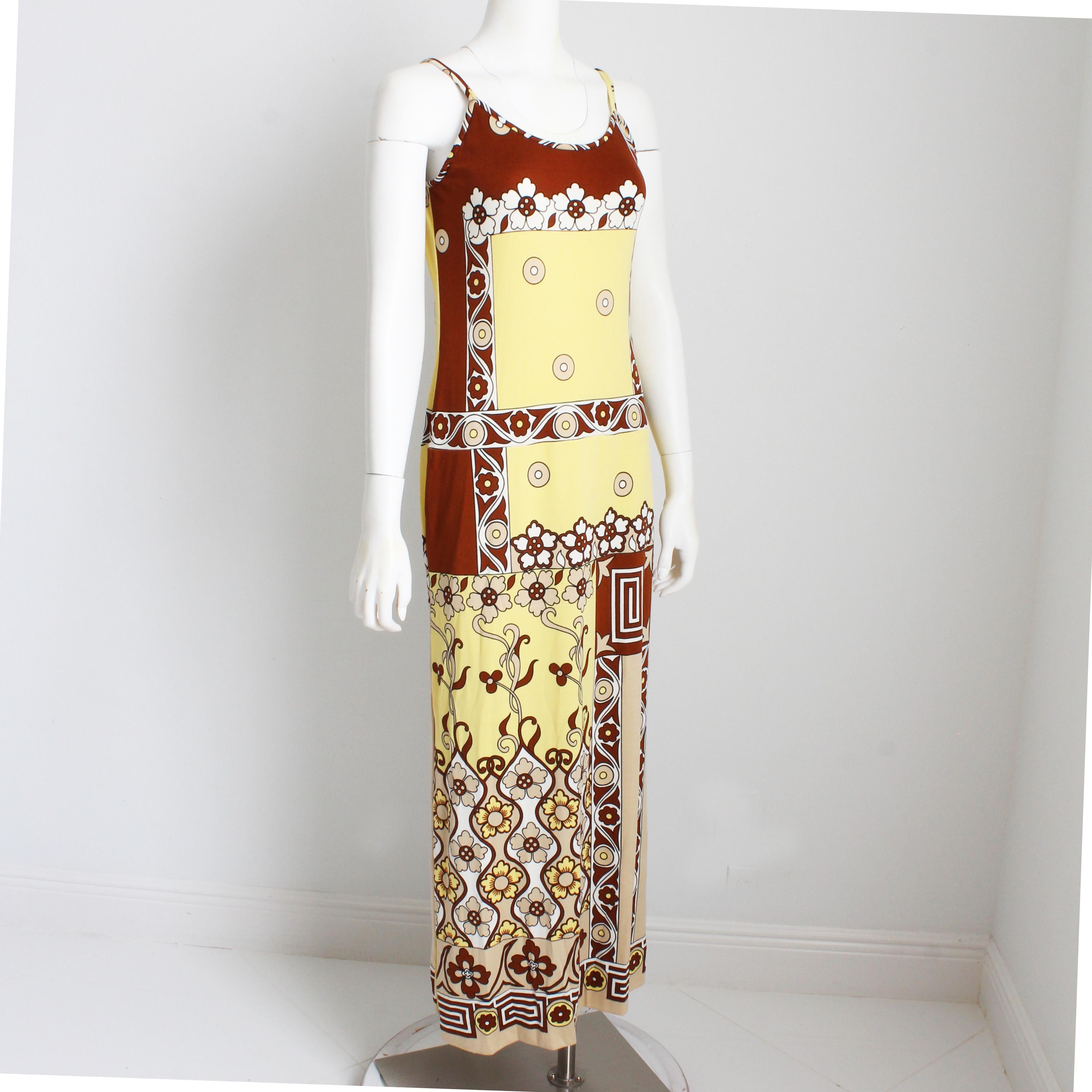 Vintage maxi dress, made by Paganne and designed by Gene Berk, most likely in the early 70s. Made from a poly/nylon blend jersey fabric, it features a bold abstract print in shades of brown, tan and yellow, skinny doubled shoulder straps and a chic
