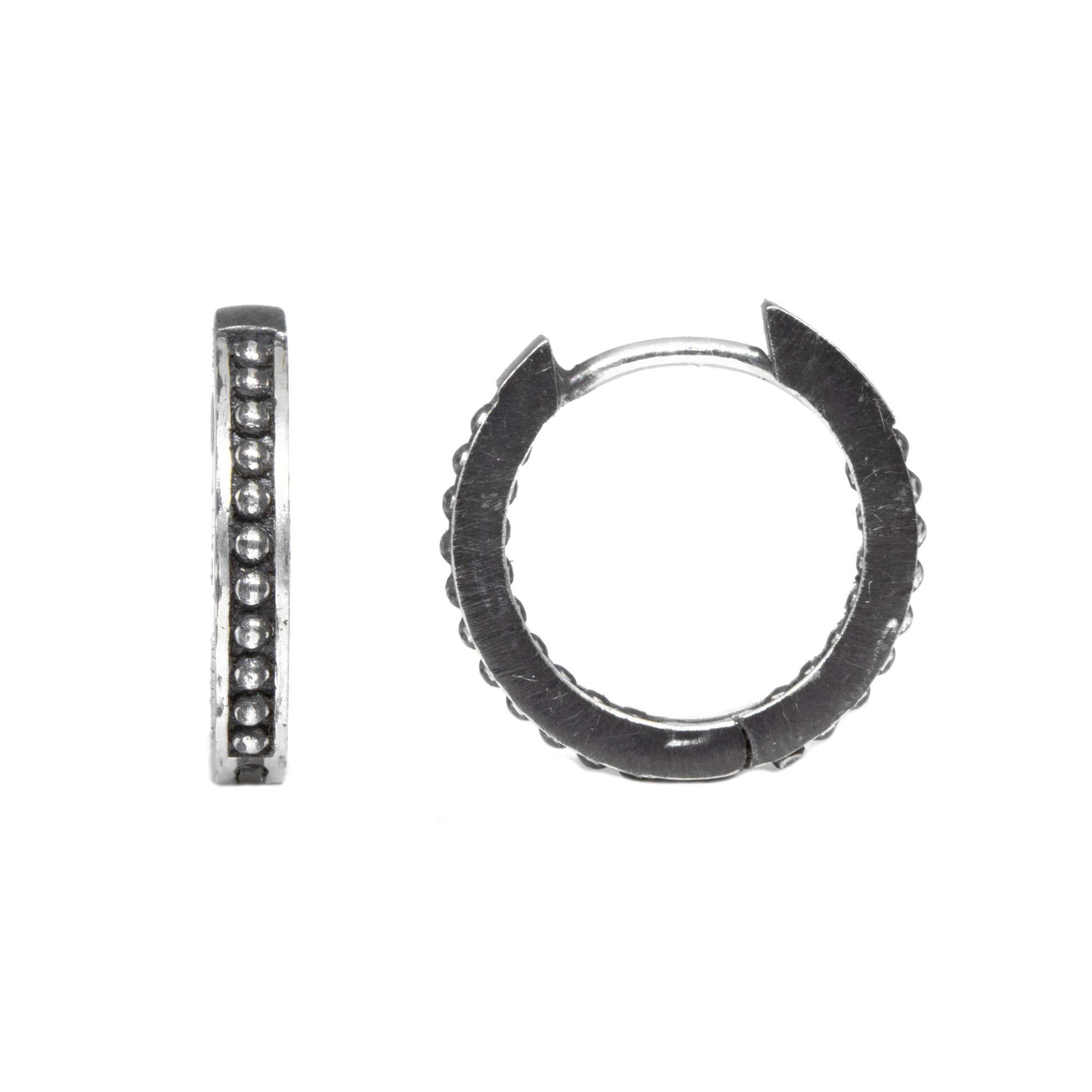 Inset with tiny silver beads, the Pagoda 15mm Oxidized Silver Hoops are made for dangling your favorite Charms (or a few). Or wear them on their own for an effortless, understated look

Details
Metal: Black Oxidized Silver
Size: 15mm

The Maker:
Our