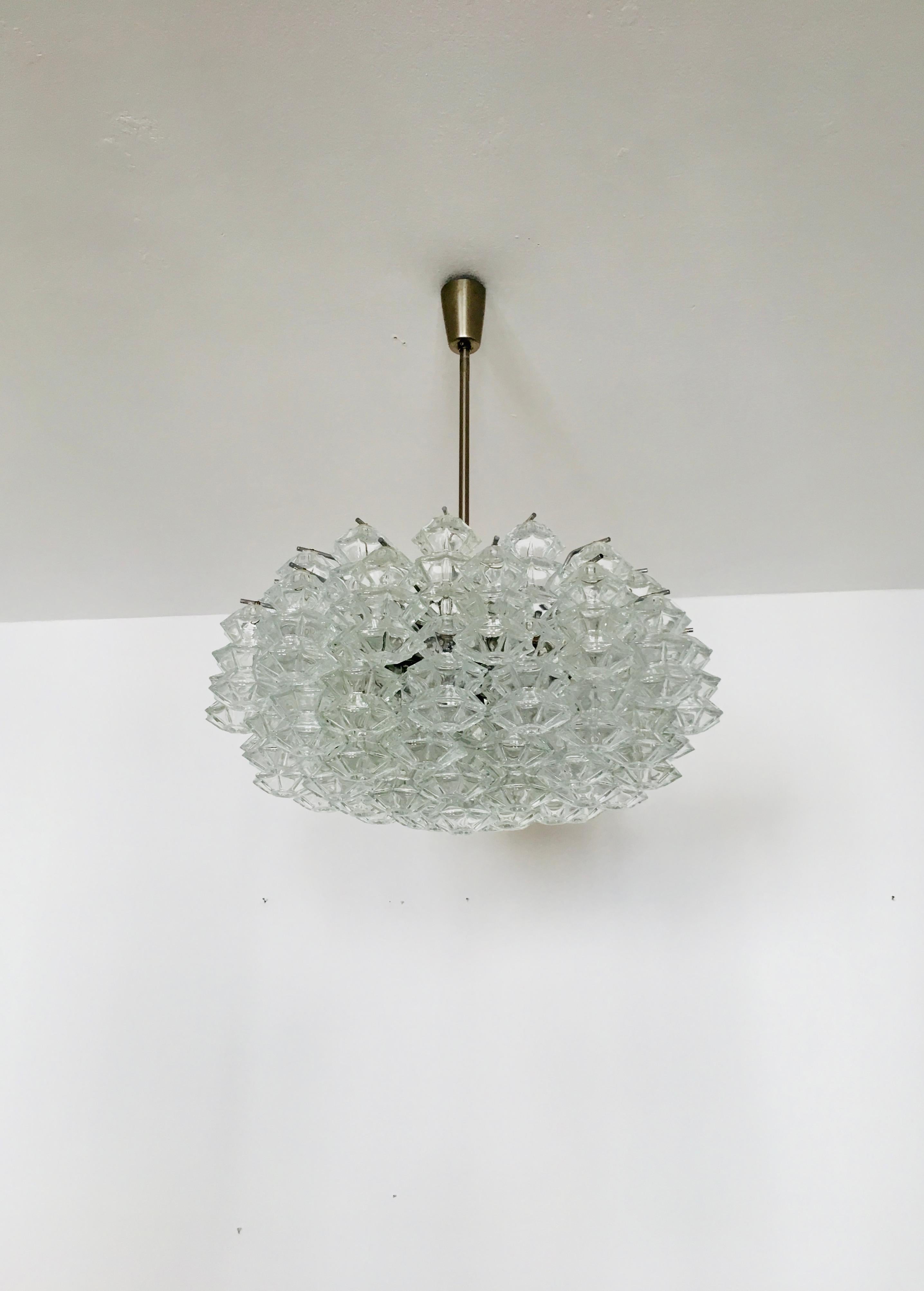 Extremely beautiful and large chandelier from the 1960s.
The 62 beautifully shaped Murano glass elements create an impressive, sparkling play of light.
Very rare version as a chandelier.
Very high-quality workmanship and a real eye-catcher for