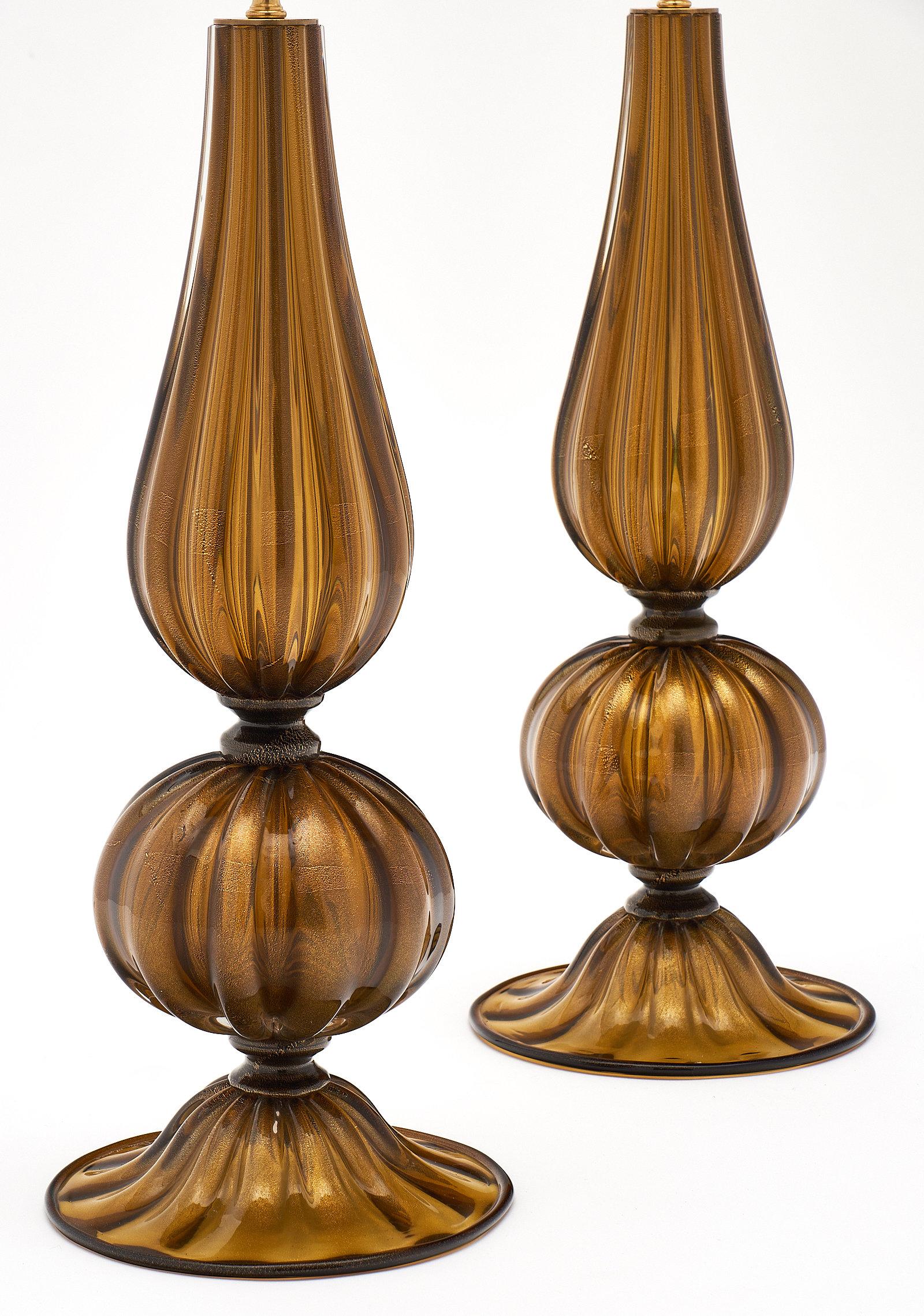 A fine pair of Murano glass “Pagoda” lamps of dark amber hand blown glass. The Avventurina process was used here, adding 23-carat gold leaf in the fusion process to create a timeless shimmering effect. This pair has been newly wired to fit US