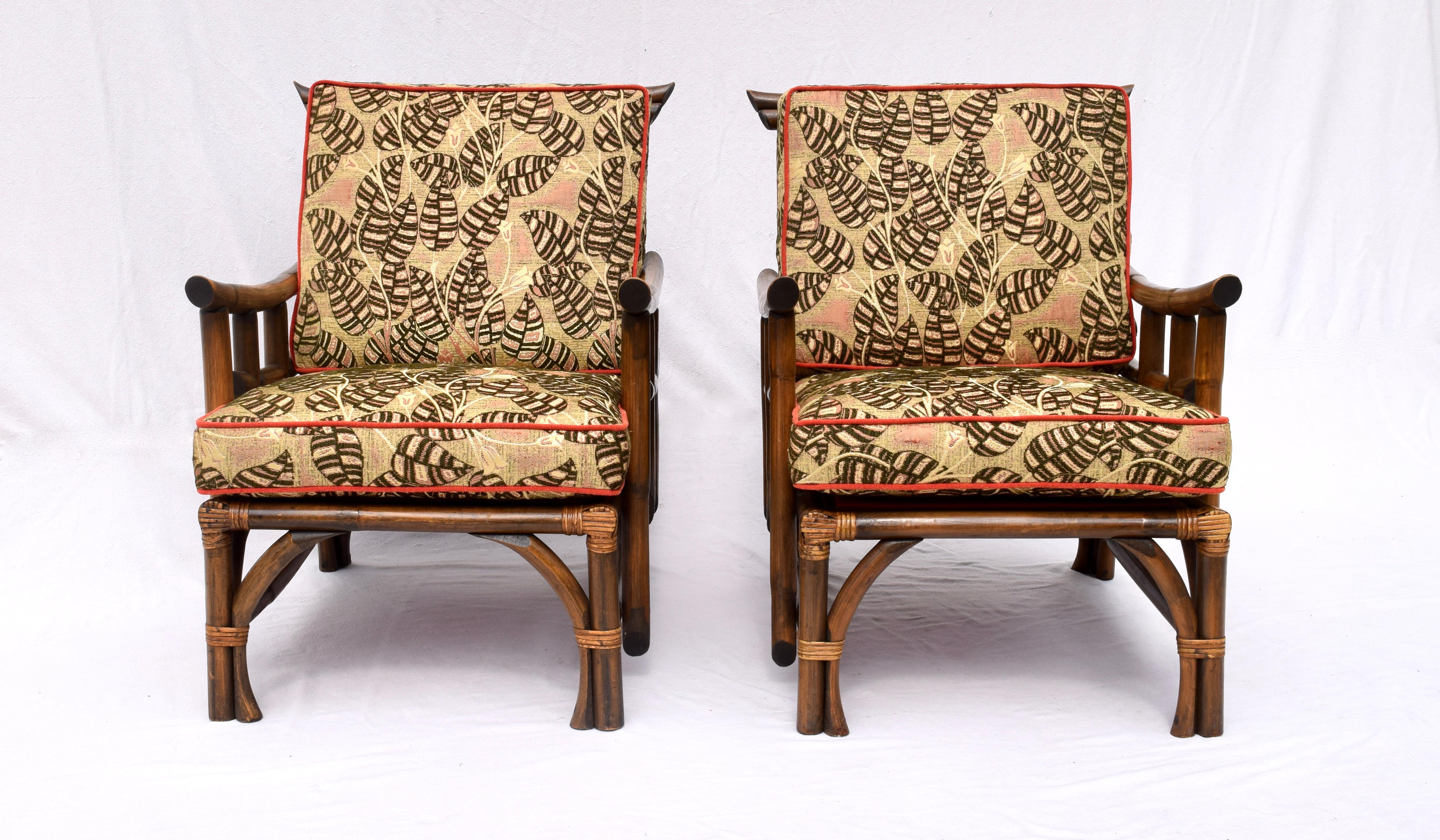 A rare pair of Pagoda style lounge chairs by Calif-Asia Company Los Angeles California, of rattan, raffia, hardwood seats and original spring construction. The matching footstool retains the Calif-Asia tag. In marvelous vintage condition the set has