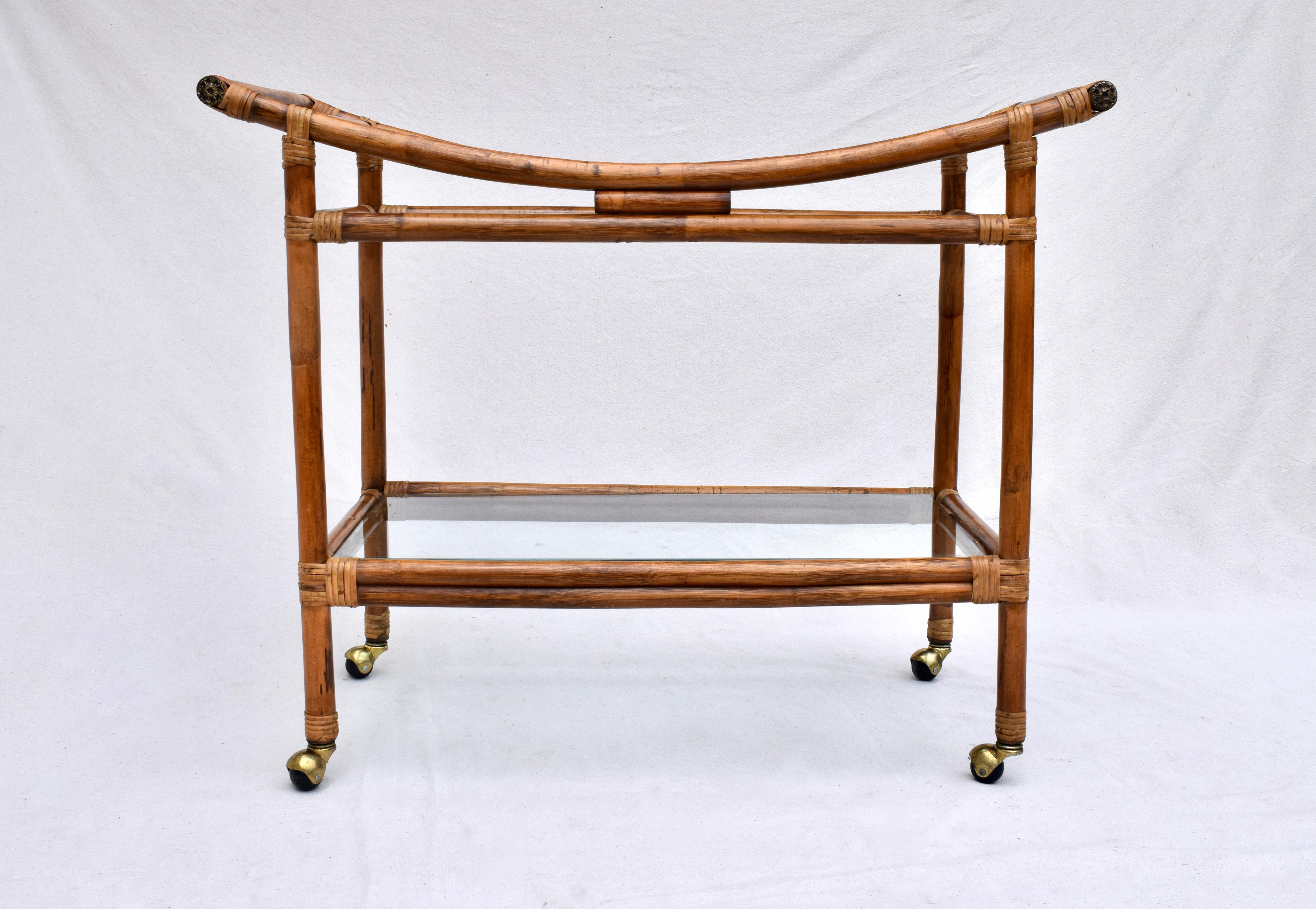 Two tier bent bamboo & glass Pagoda influenced bar cart or serving cart on casters attributed to Calif-Asia. Versatile understated design, generous in size.