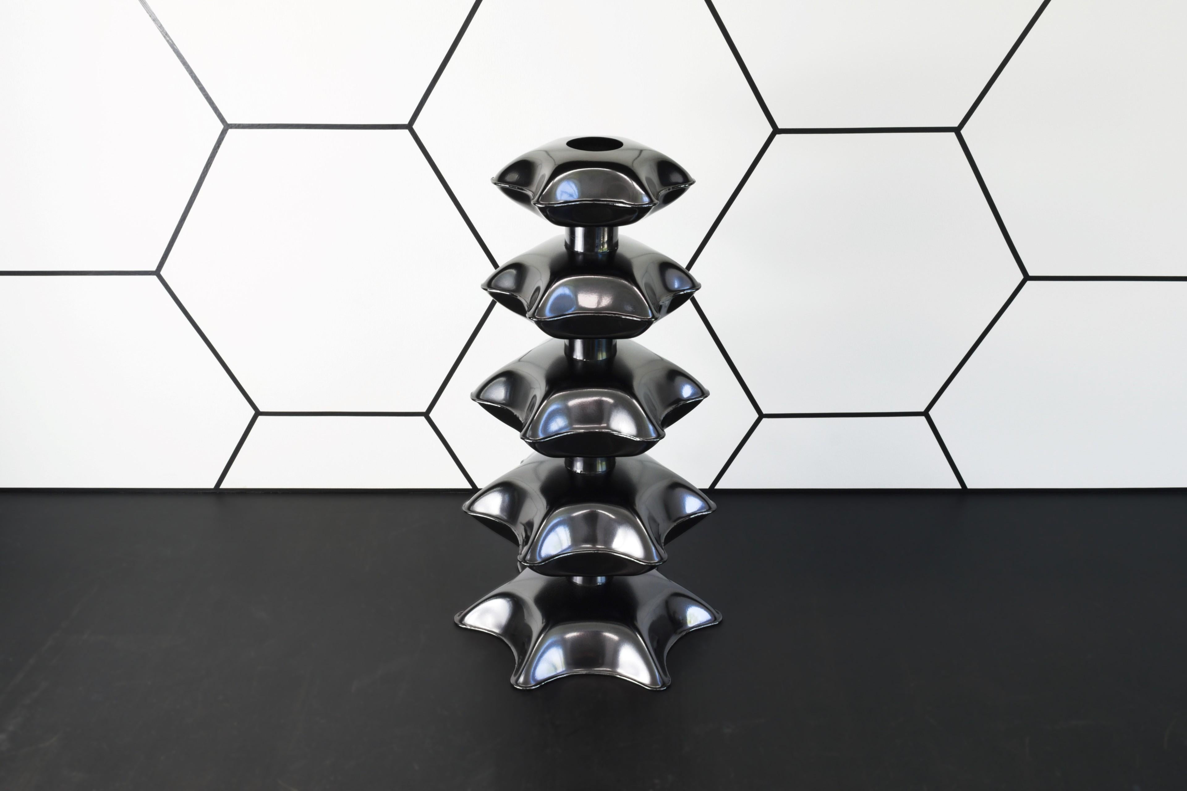 Reminiscent of architecture from the far east, the Pagoda vase developed from experiments with inflating steel, and an ongoing desire to discover exciting new forms with the process.

?To create the piece, pairs of flat hexagonal sheets are welded