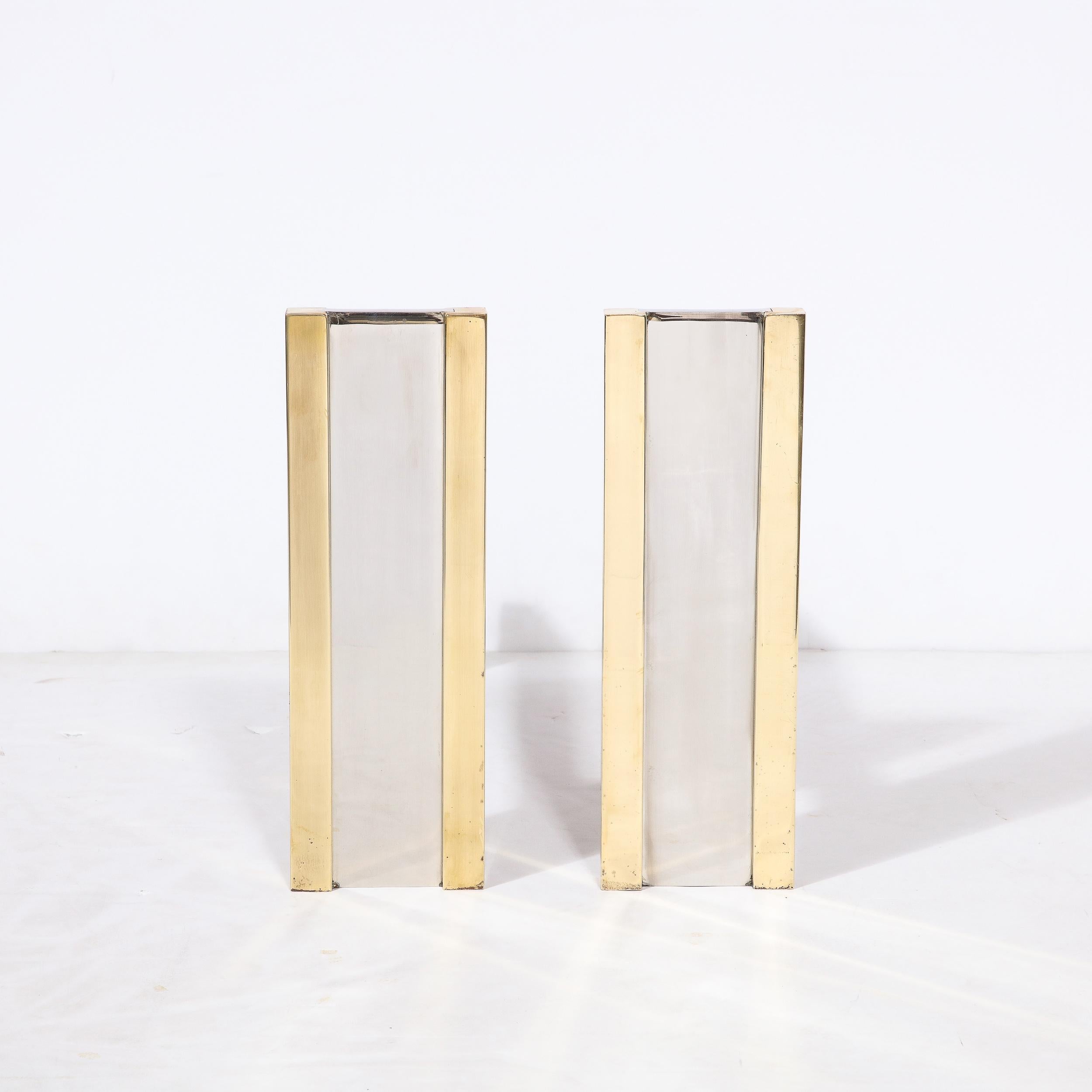 A striking pair of Mid-Century Modernist andirons by the American designer, Danny Alessandro. In the 1980s Alessandro began making furniture and lighting in his woodshop in Santa Barbara, California where he was known for his Mid-Century Modernist