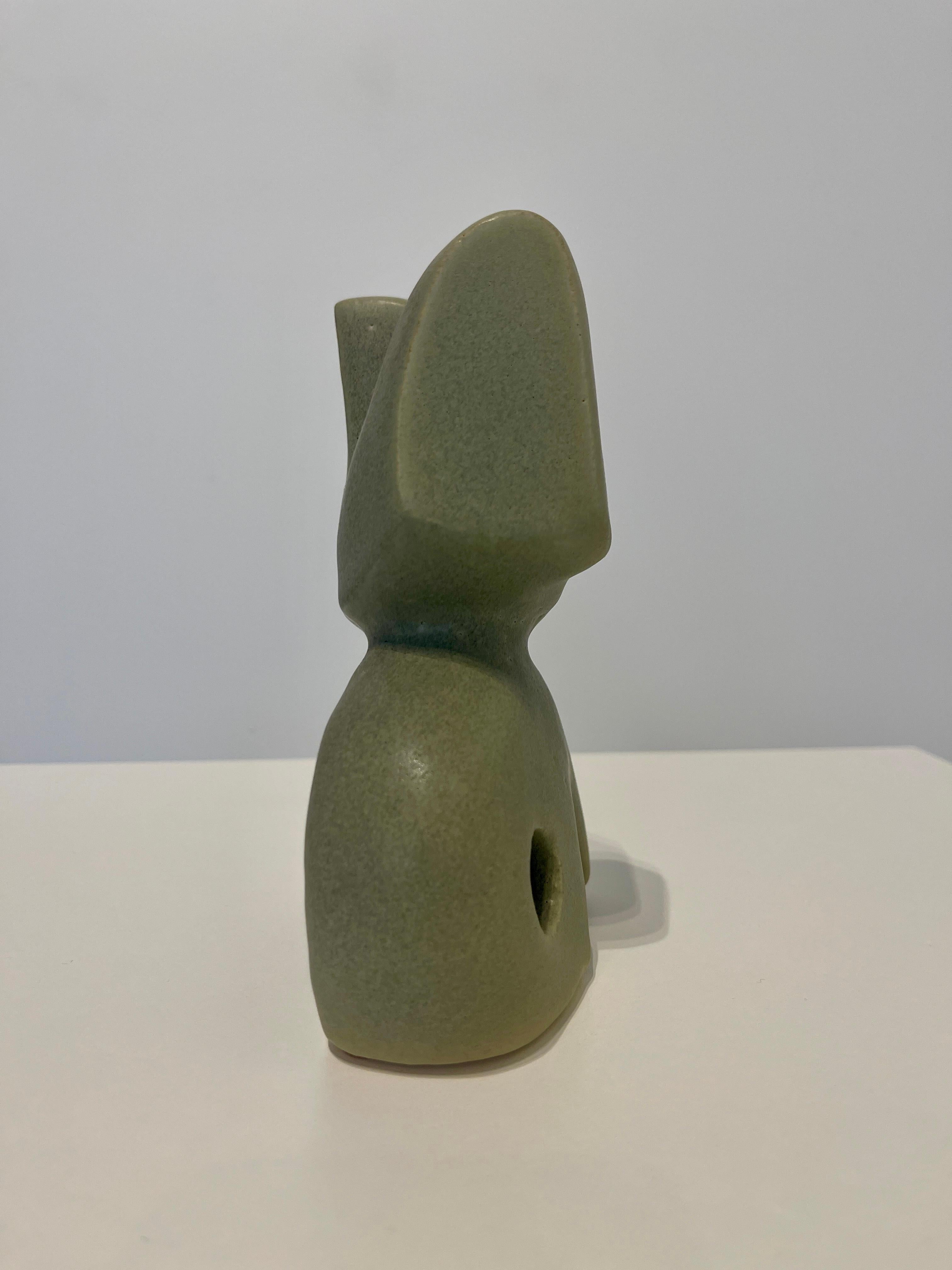 “Bodies at Rest” #24 is a one-of-a-kind, ceramic abstract figurative sculpture by Paige Stewart (in matte green glaze) is a small scale sculpture that add class and personality to home decor, or a thoughtful gift.

This abstracted ceramic figural