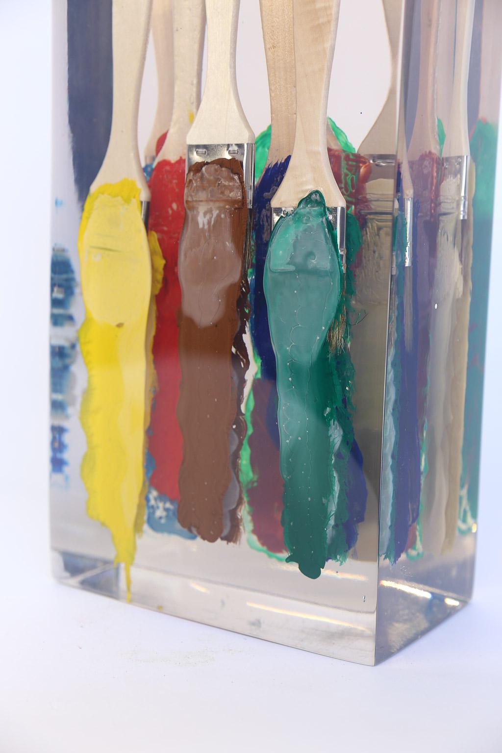 Add that touch of the unexpected with this whimsical art work of paint and paint brushes emerged in resin. With the free floating illusion of the brushes it is sure to start a conversation if placed in your home.