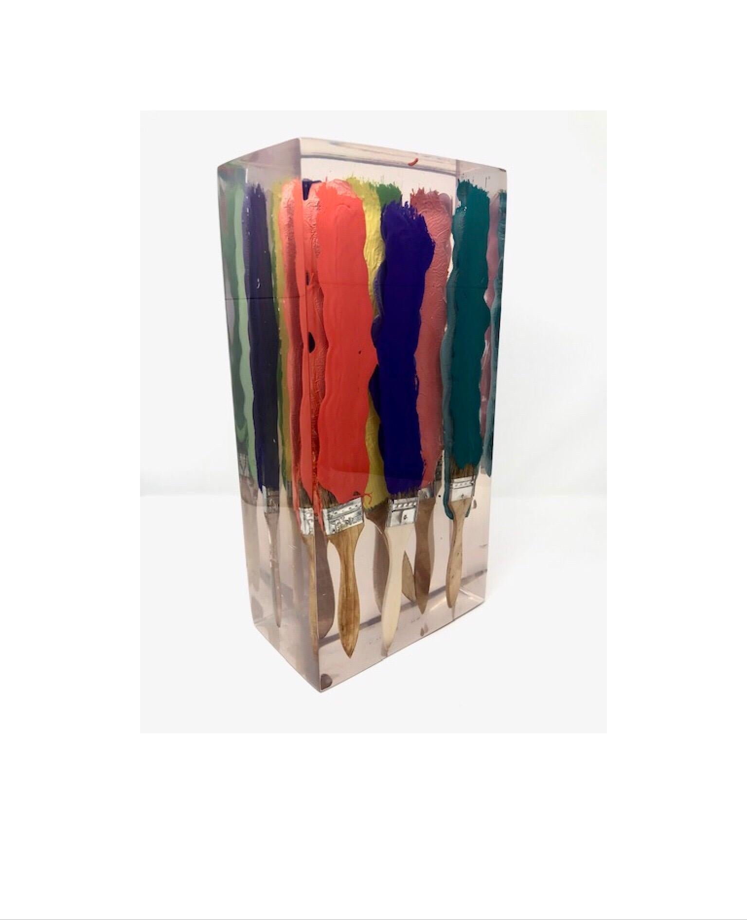 Add that touch of the unexpected with this whimsical art work of paint brushes emerged in resin. With the free floating illusion of the paint and brushes it is sure to start a conversation if placed in your home or office.