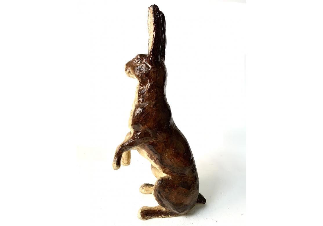 A heavy paint decorated cement bunny sculpture with a soulful expression right out of a storybook. This bunny stands erect and poised for attention and would be a welcome addition to a garden setting.
Dimensions: 26