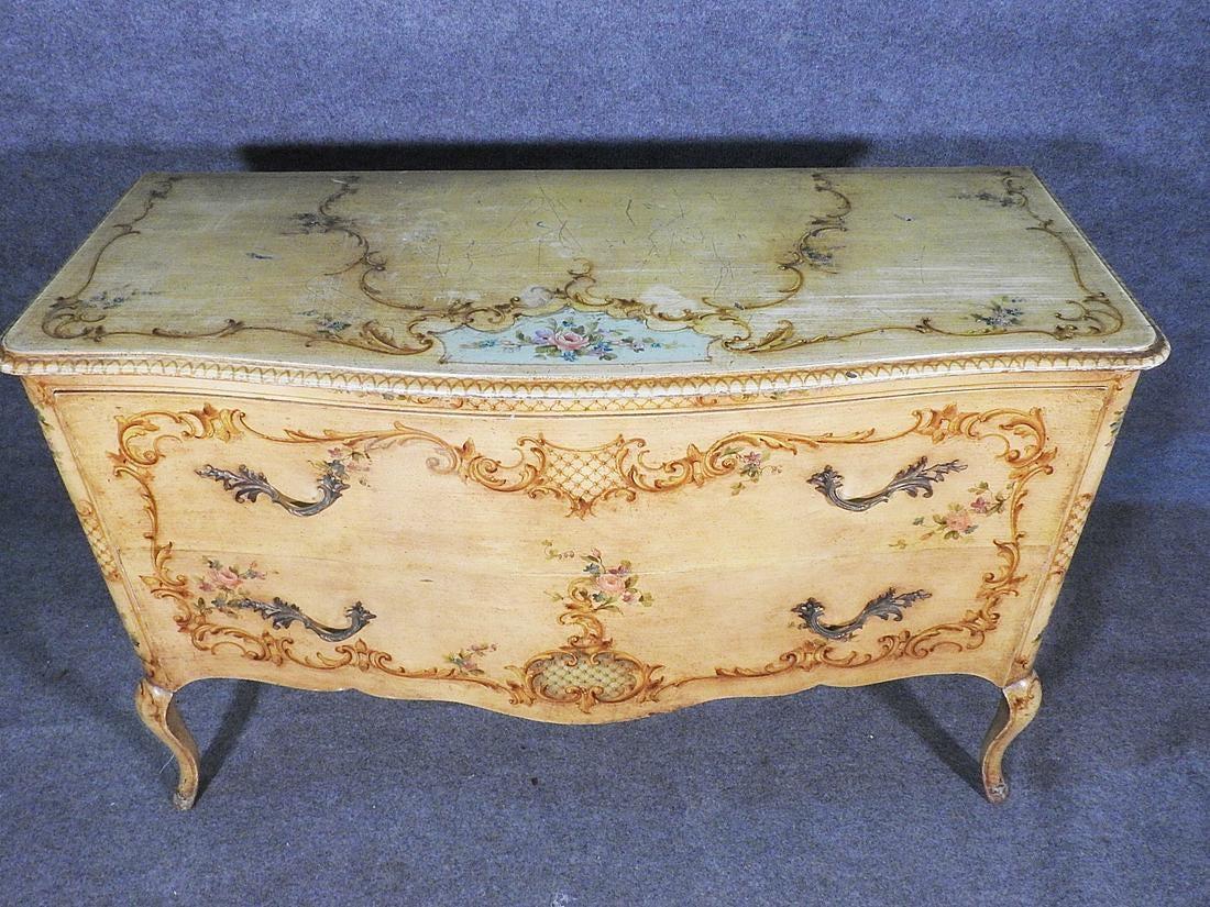 This is a gorgeous painted French commode. The piece can be used in a multitude of ways and has wonderful painting. The top has some minor surfaces scratches as show paint decoration. 2 drawers. Measures: 33 1/4
