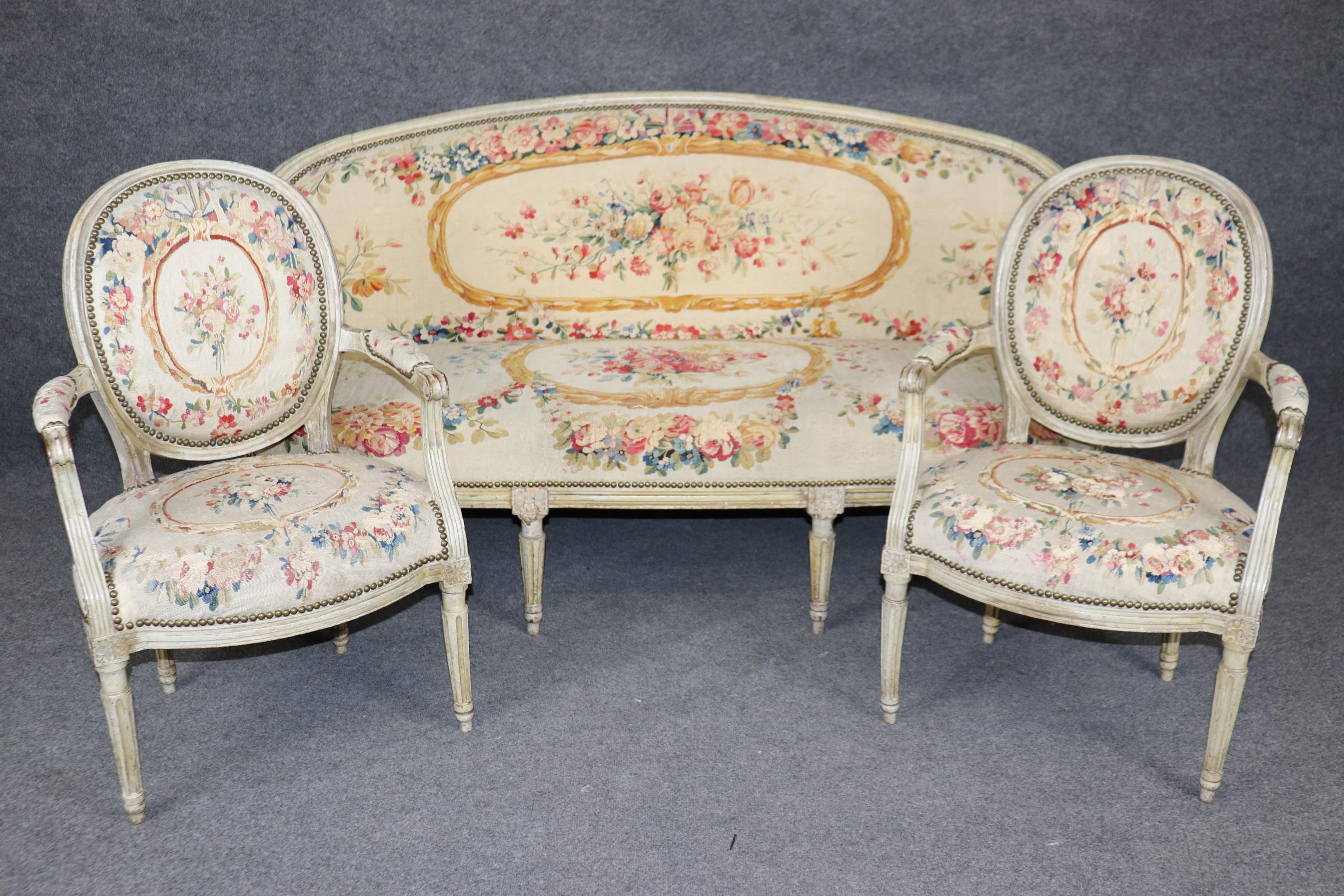 This is a superb parlor or salon set from a famous (though we can't say who) philanthropist from Manhattan. The set features gorgeous tapestry upholstery which we believe is Aubusson or less likely Belgian tapestry. The set had an original cost of