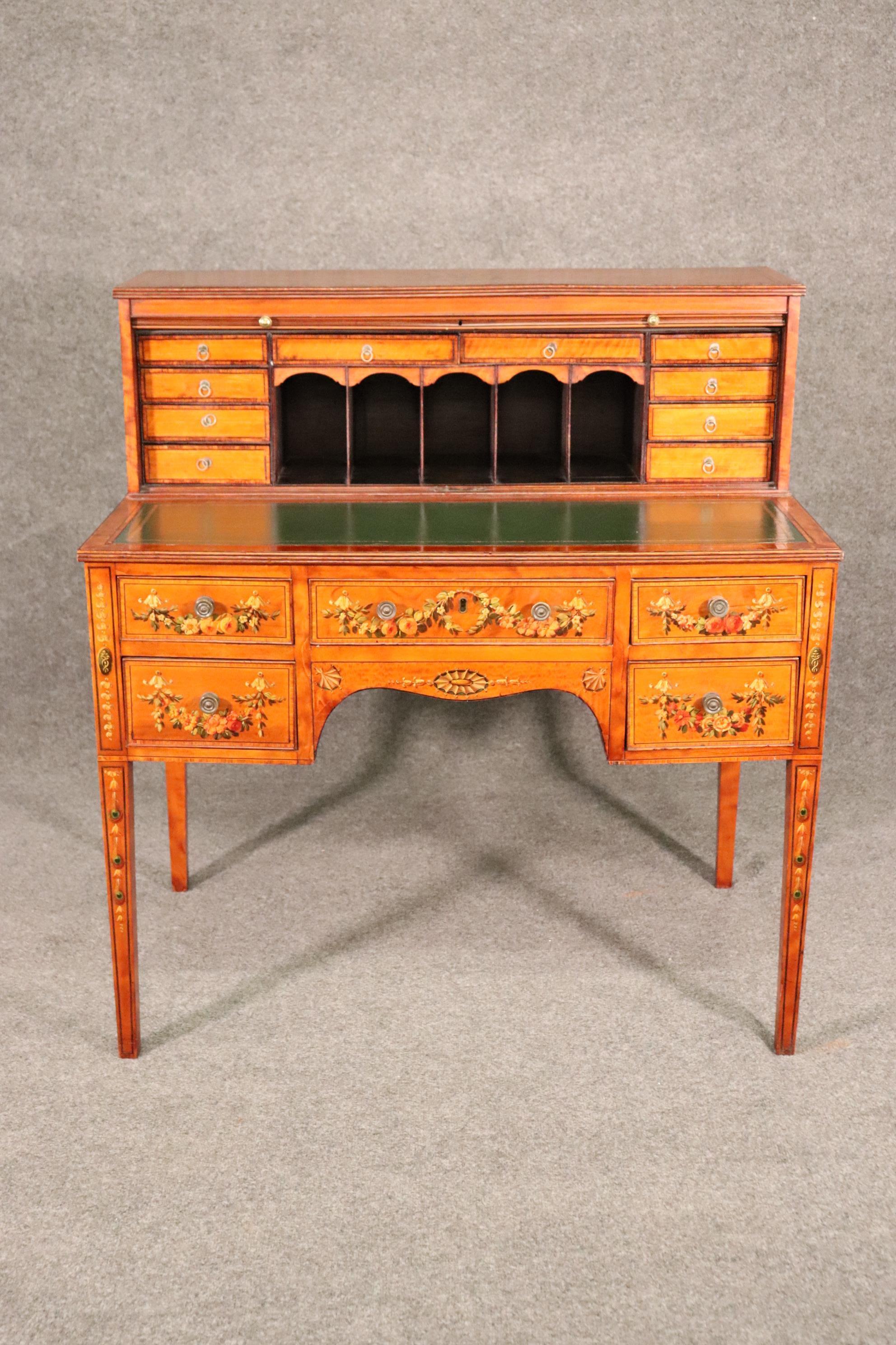 This is a fantastic desk! Look at the amazing painted workmanship and the gorgeous wood quality. The desk measures 40 wide x 42 inches tall x 25 deep. The desk dates to the 1910 era and is in good original condition.