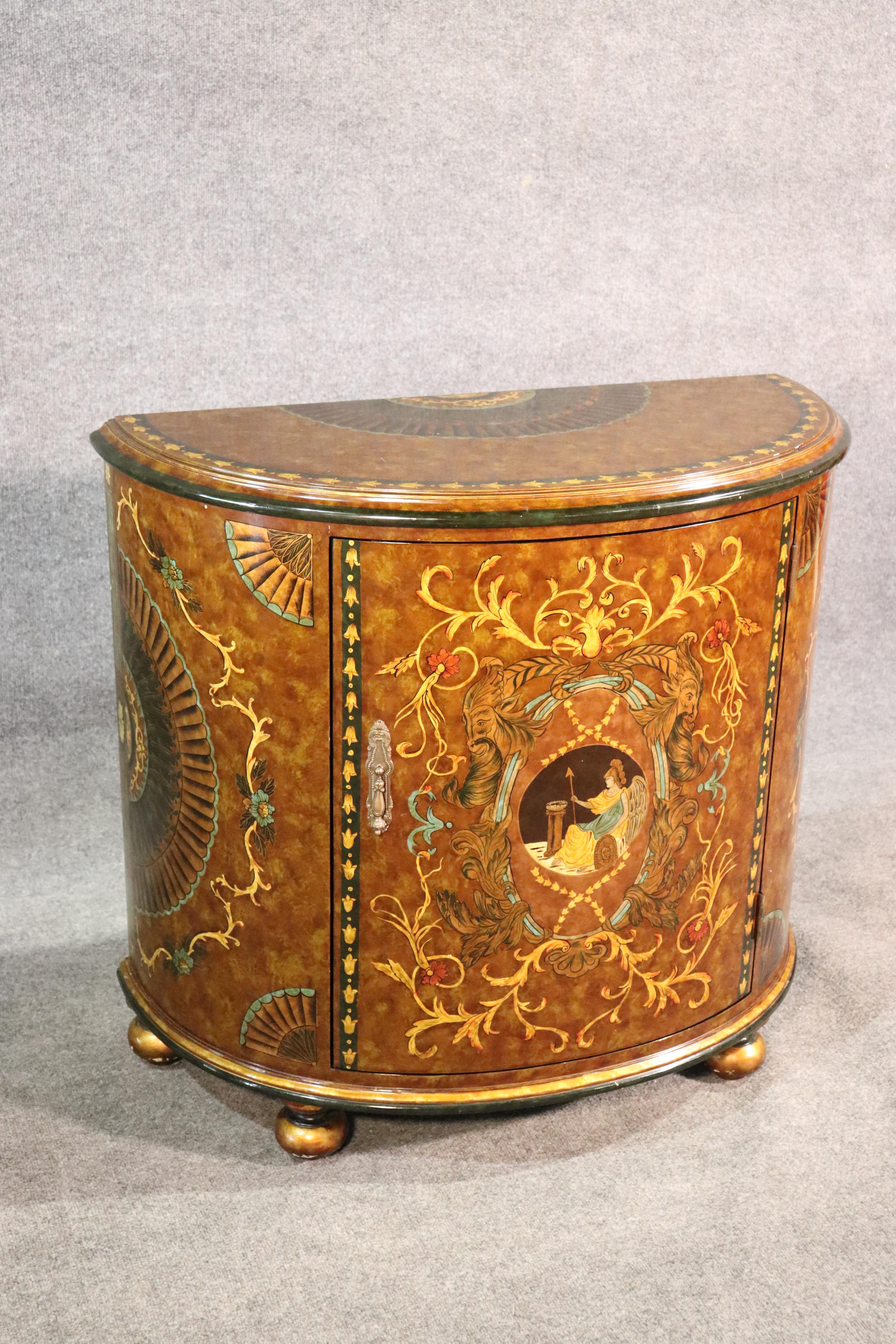 This is late 20th century Venetian style demilune commode. The painted and sgraffito decoration adds interest and wonder to a normal simple design. 

Measures: 33 tall x 36 wide x 17 deep.