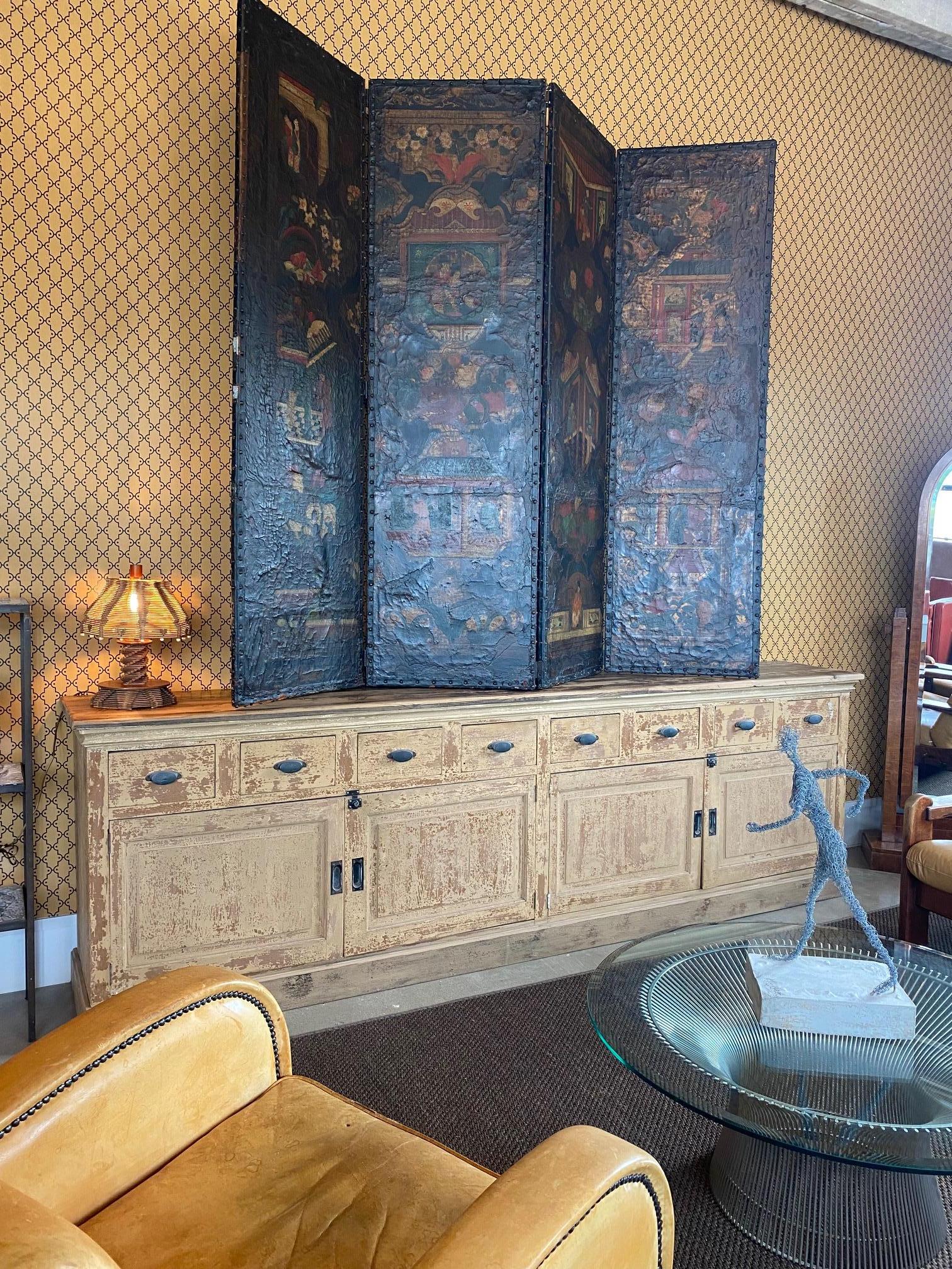 Charming and generously scaled nine foot sideboard in original ivory paint with lots of patina.  Includes four doors and eight drawers with iron hardware.  France, 19th century