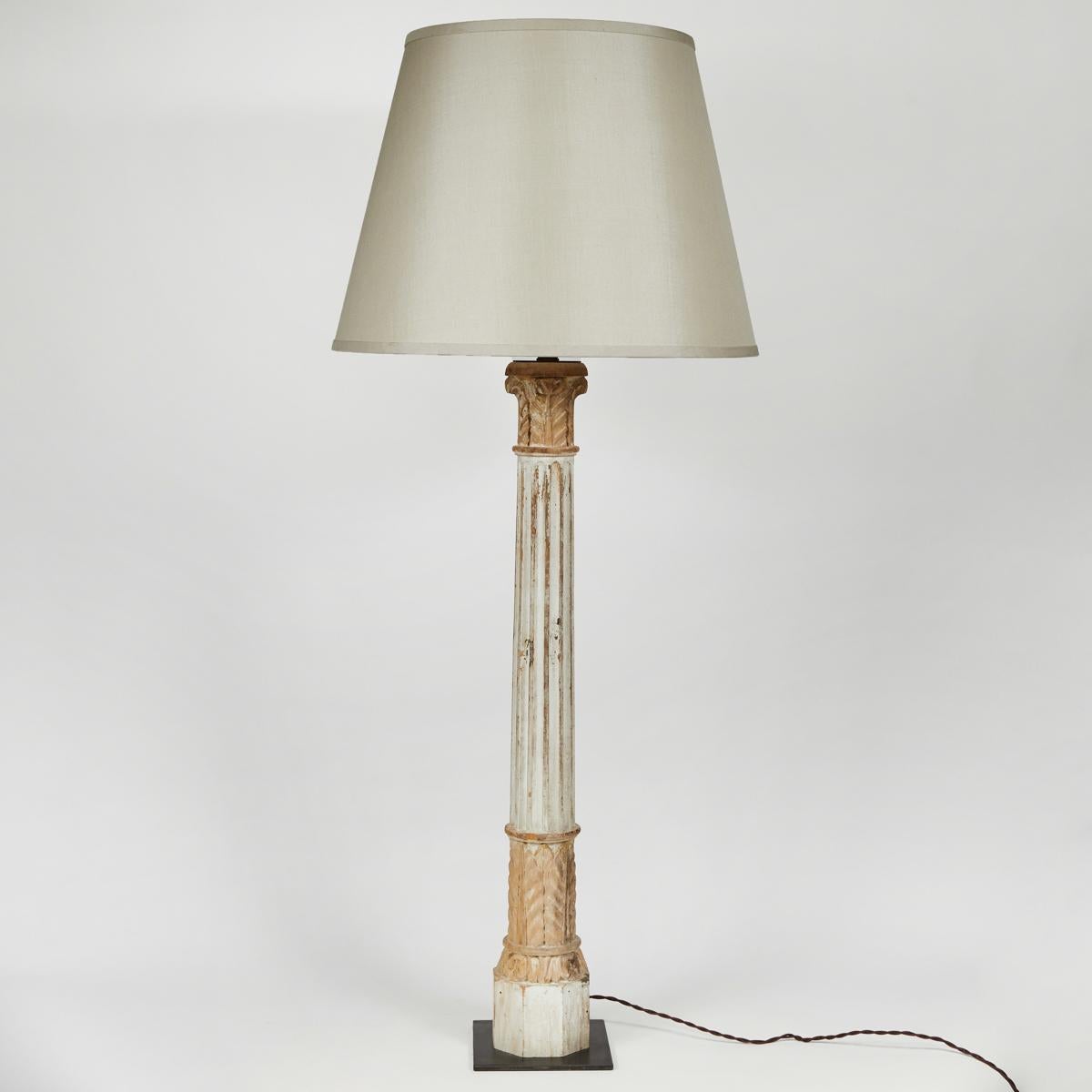 Rustic white painted carved wooden column lamp from 19th-century France. Featuring acanthus leaf carvings, Corinthian capitals, and a custom cream linen shade, this charming lamp brightens any space.

France, circa 1880

Dimensions: 6W x 18D x 44H