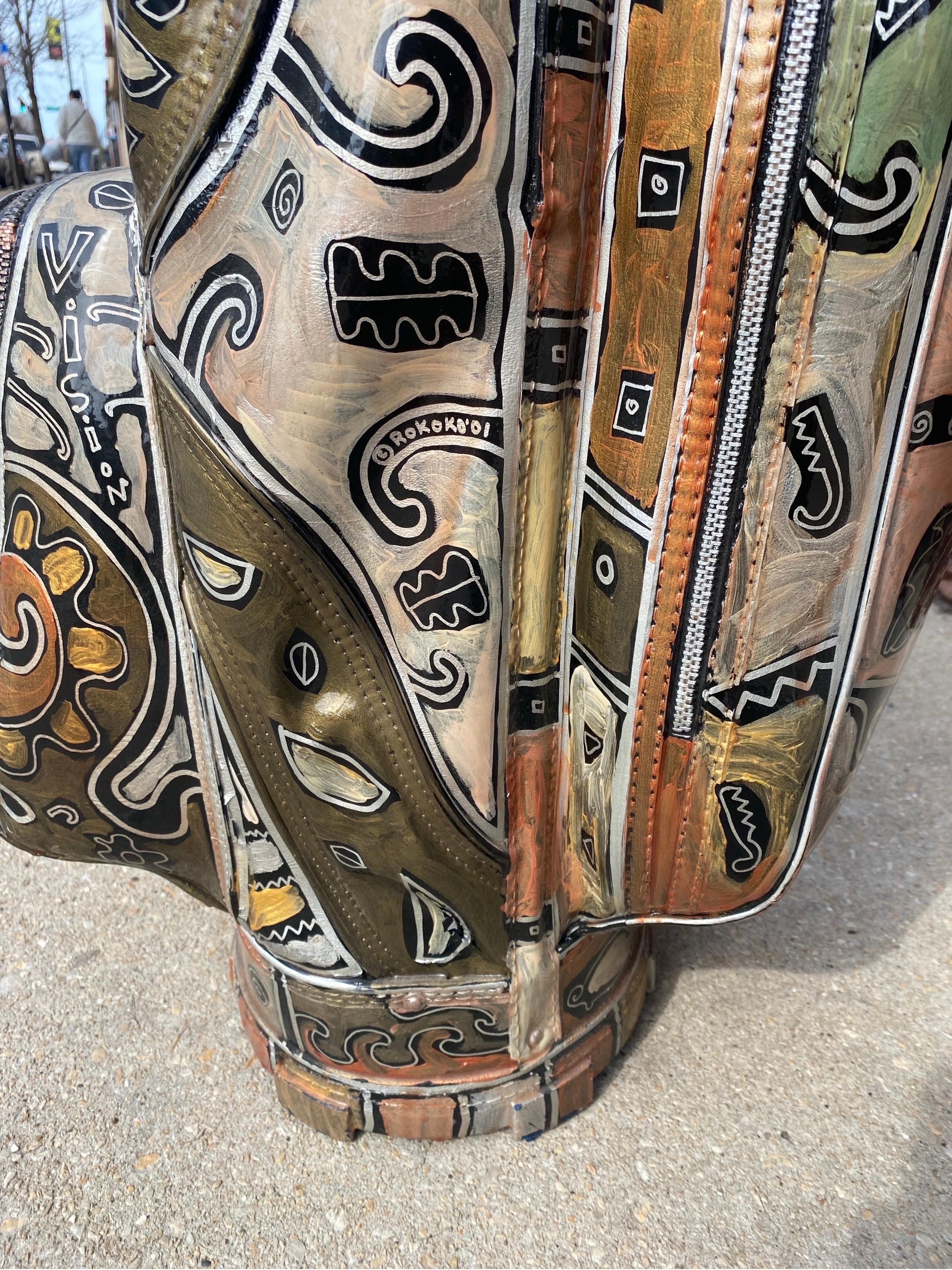 Painted Ajay Golf Bag & Four Painted Golf Clubs signed by Artist, Rokoko

This repurposed Ajay golf bag and five clubs have been completely decorated with abstract and figural drawings, phrases, and color blocks. Many drawings are golf-themed, but