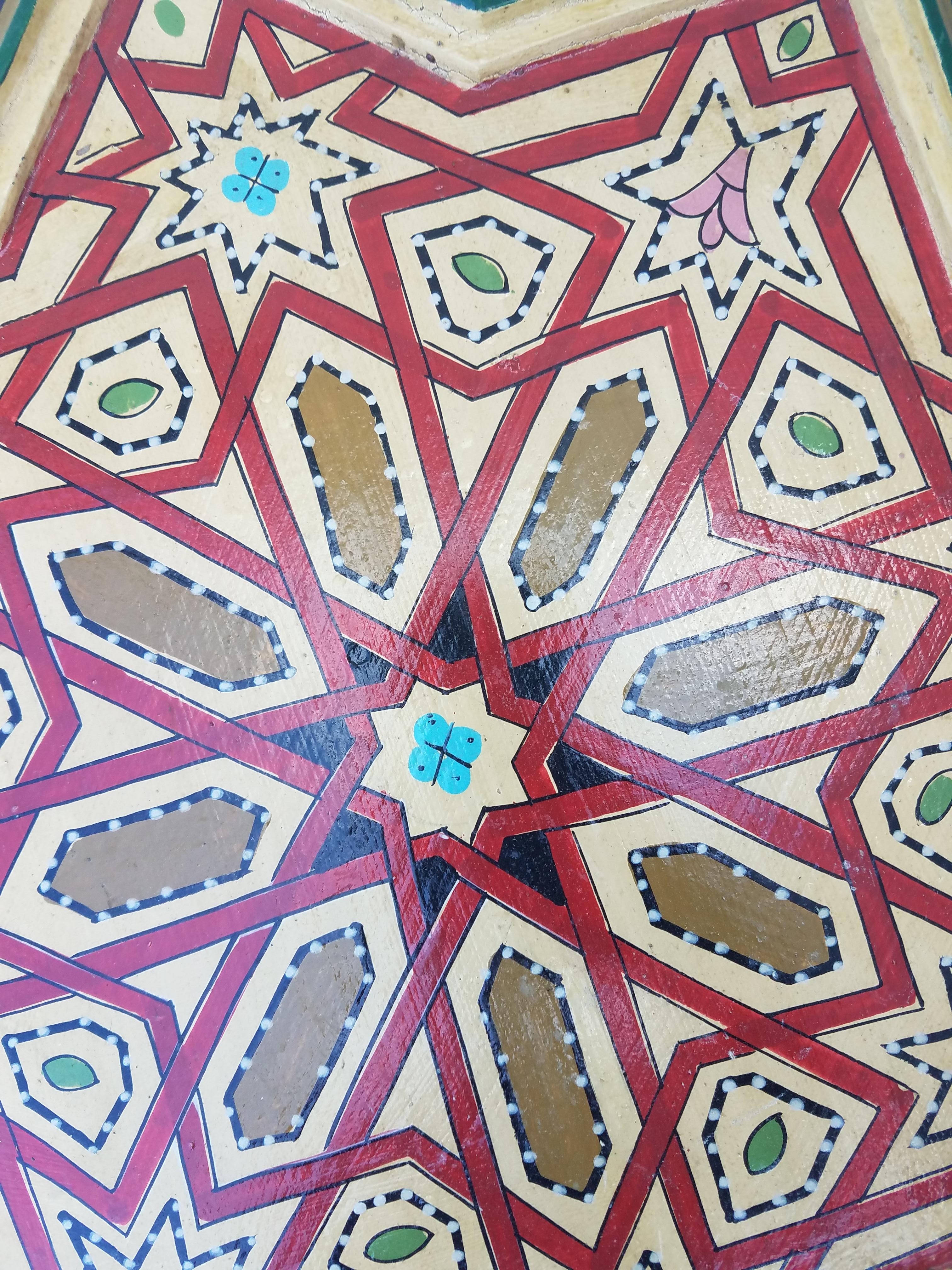 Rare find! Carved and 100% hand-painted Moroccan star shape side table. Amazing carving around the side and hand painting throughout the entire table. Beautiful add-on to your Decor. This table measures approximately 20