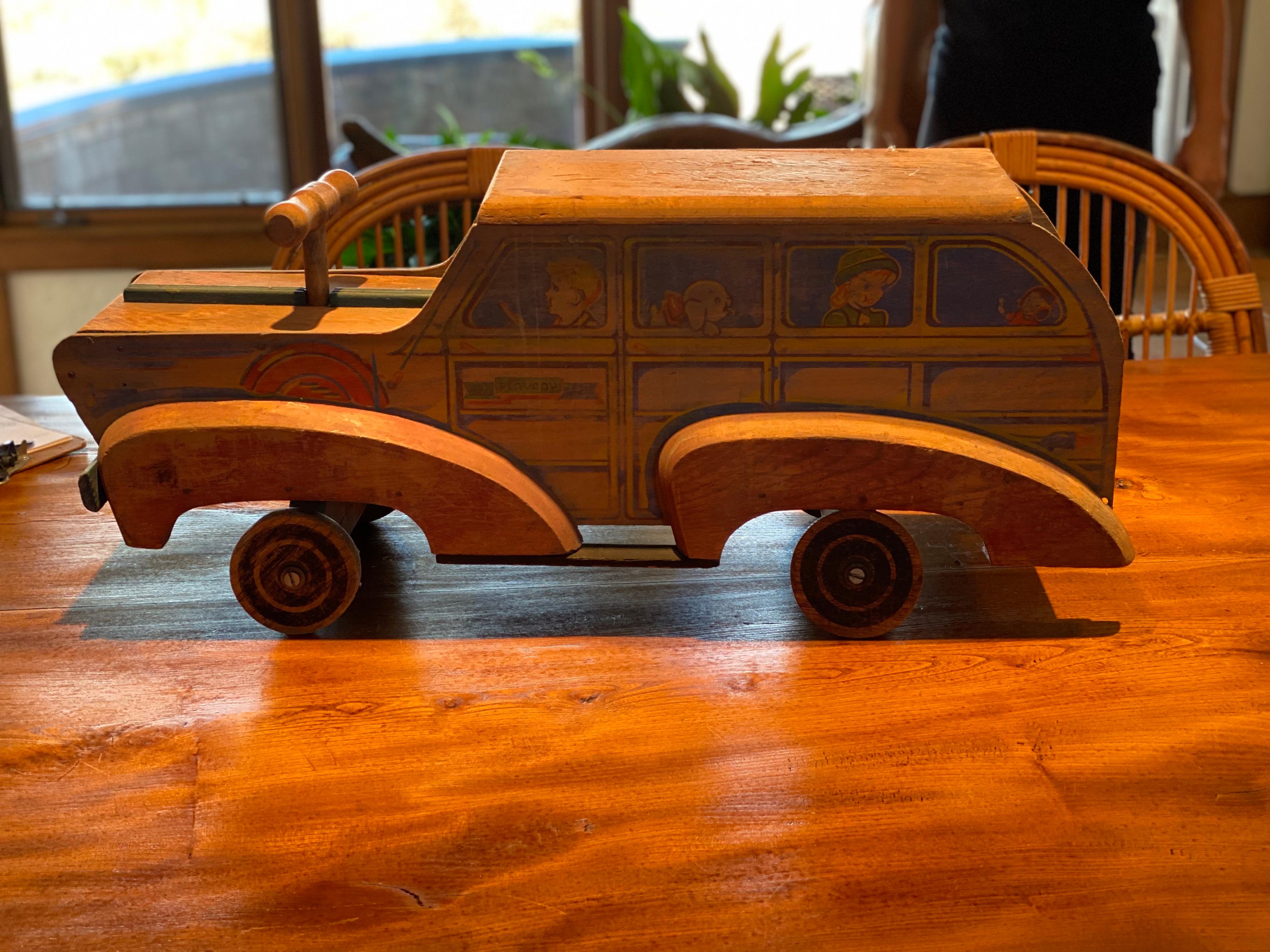 A painted and carved wood toy car,
circa 1930-1940
Modeled as beach wagon, stencil-decorated with
children. Sit on and ride toy.
Measures: 13 1/2 in. high, 31 1/2 in. length, 12 in. deep
Sun fading and surface wear throughout.