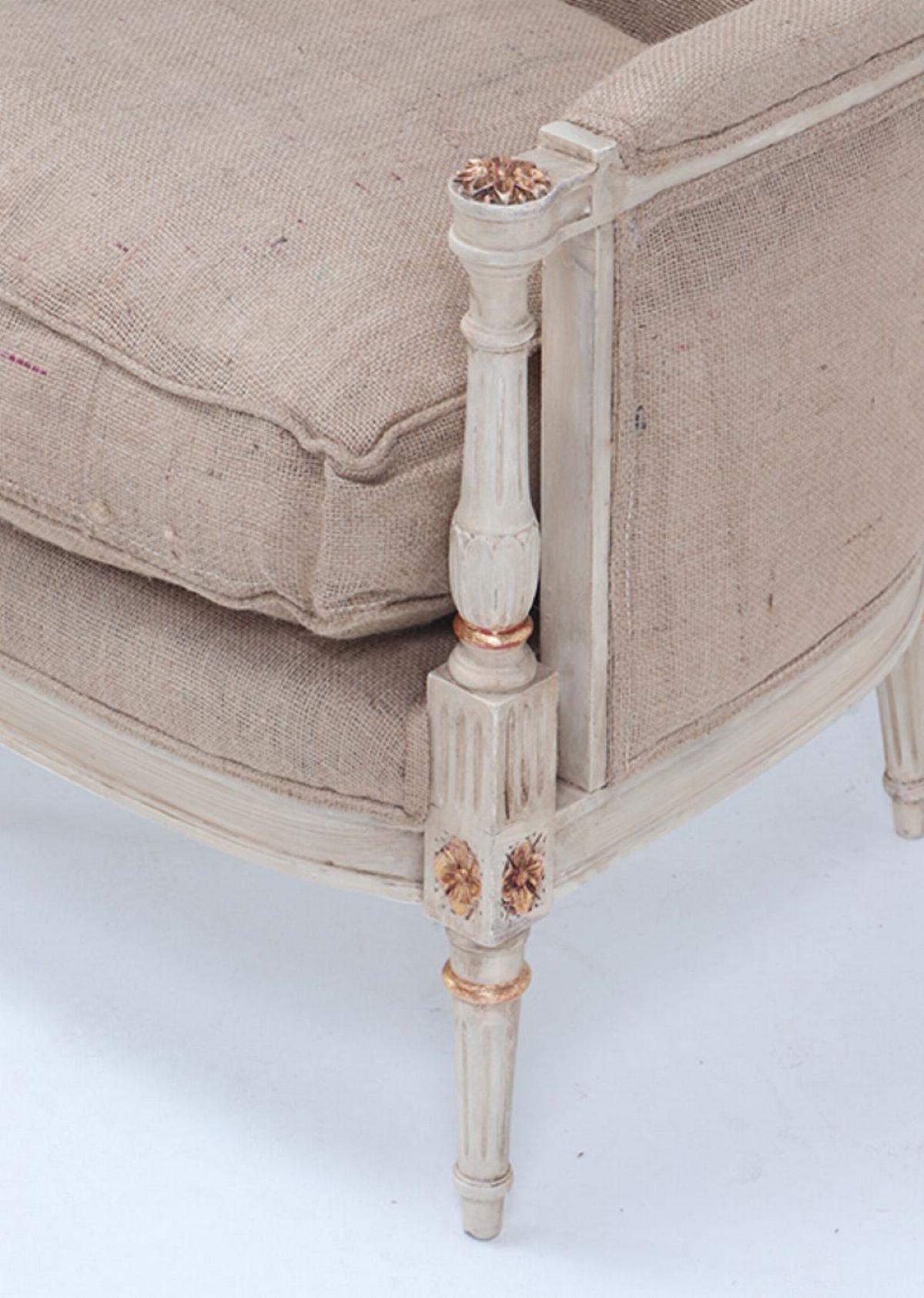 Painted and gilt Louis XVI style bergere chairs circa 1950. In Good Condition For Sale In Philadelphia, PA