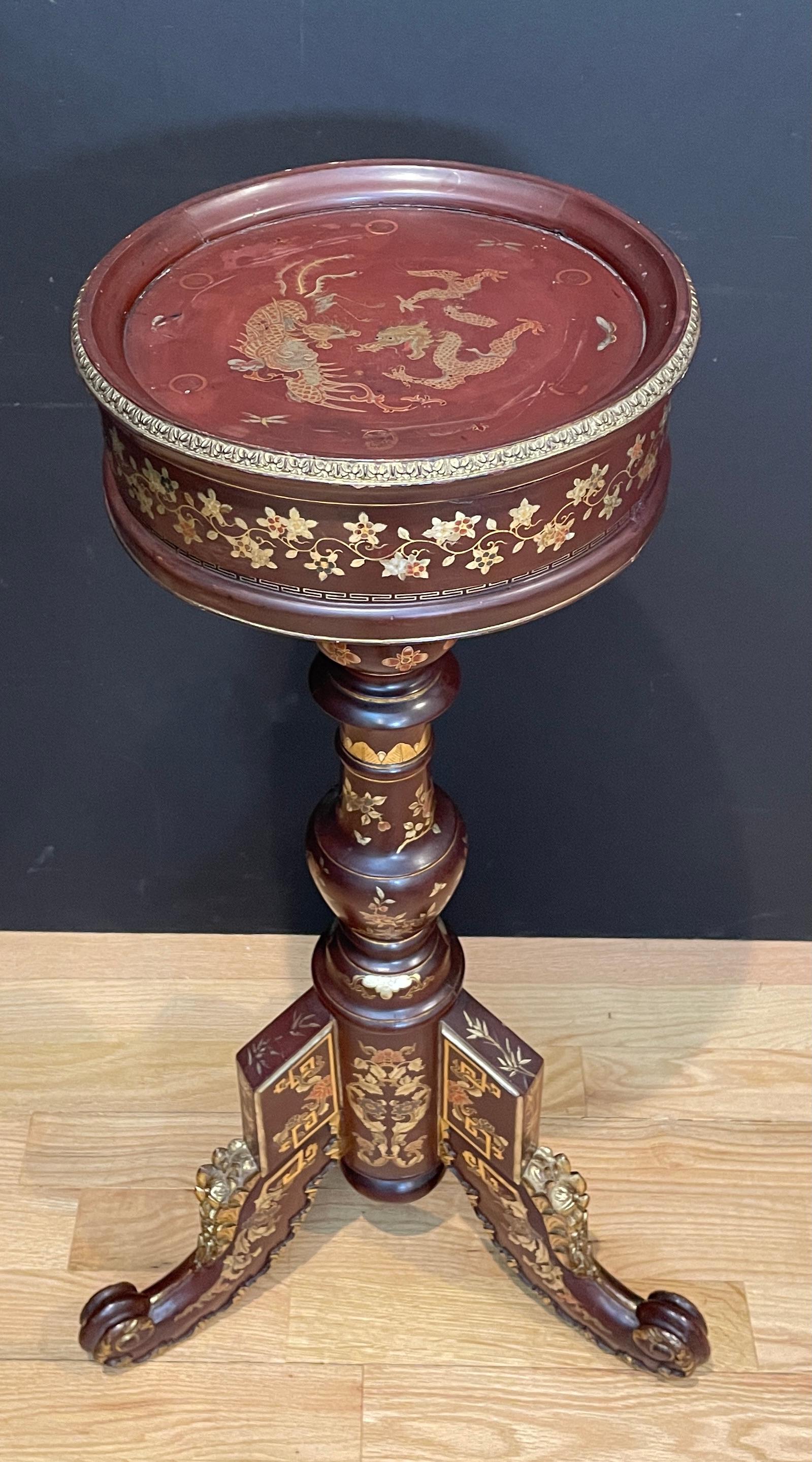Japanese style French 19th century carved and red painted wood pedestal with gilt and silver gilt embellishments. Deep red-brown lacquer finish. Gilt dragons and floral decorations.
Top surface 11.5