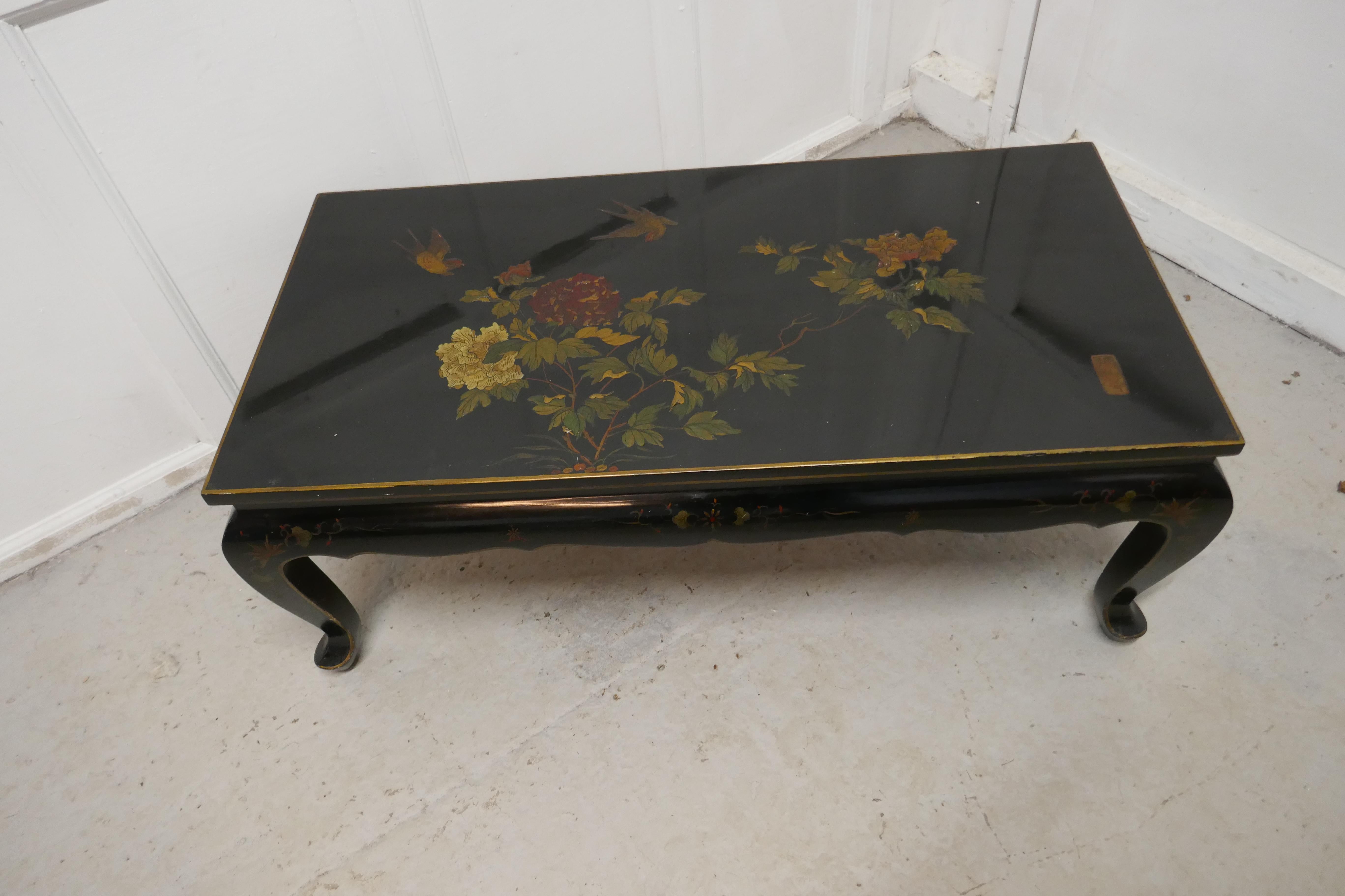 Painted and lacquered chinoiserie coffee table

This is an early 20th century piece, the table stands on cabriole legs in the Art Deco style with a shaped decorated apron below
The table is decorated with a black lacquer background and raised