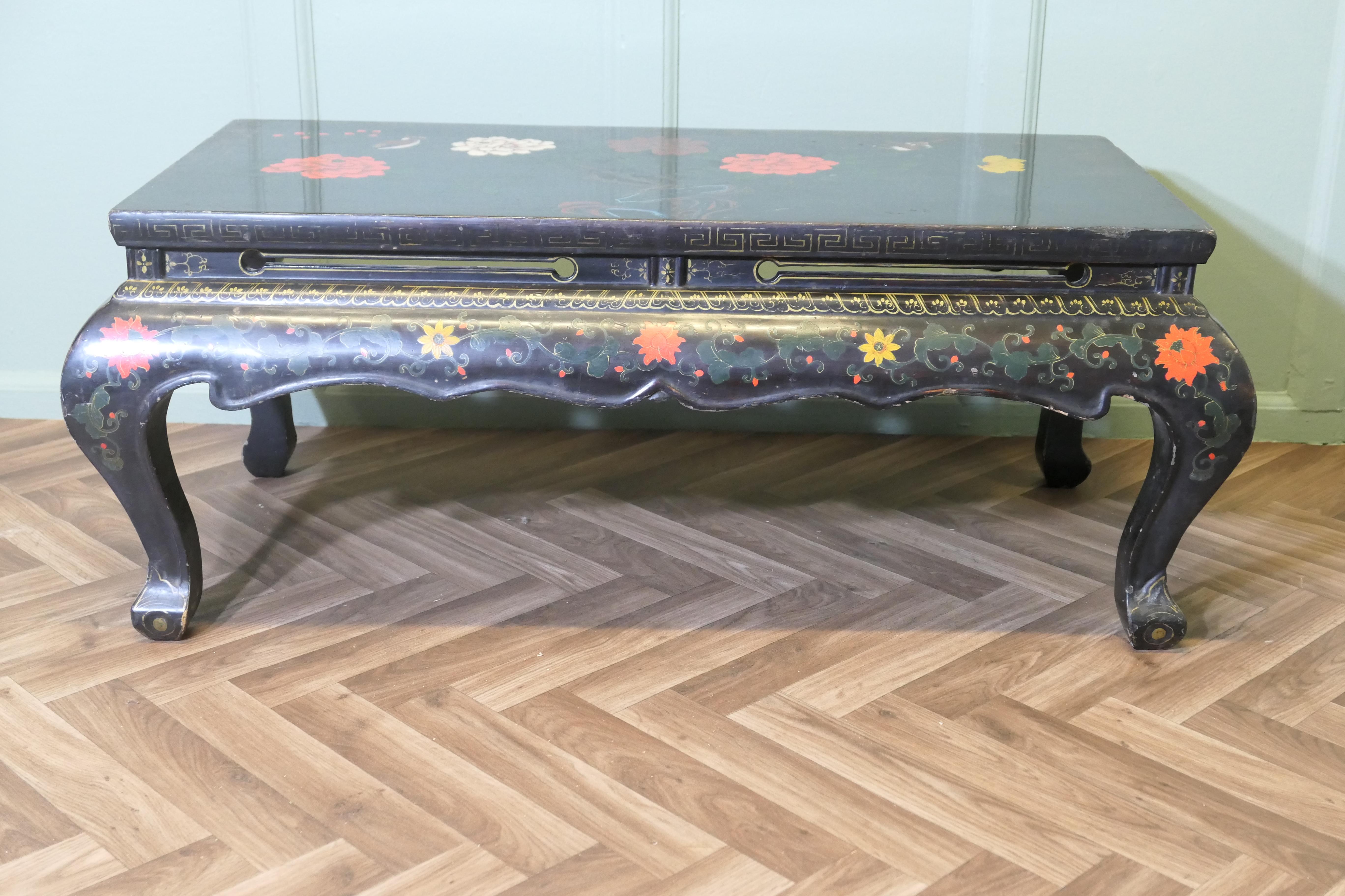 Painted and Lacquered Chinoiserie Coffee Table  

This is an early 20th century piece and a very attractive design  
The table stands on shapely legs in the oriental style with a deep shaped and decorated apron below
The table is decorated with a