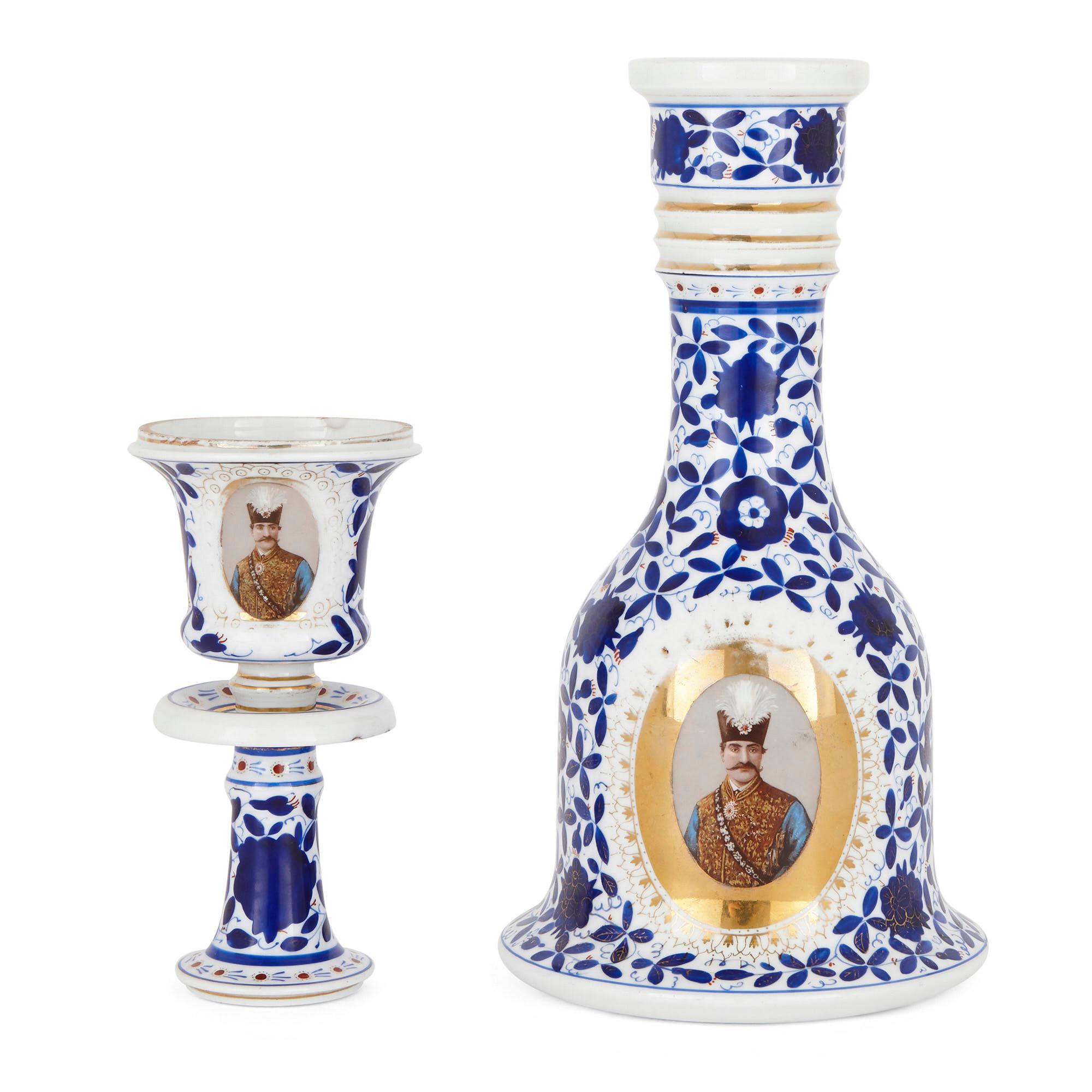 This wonderful porcelain huqqa (or hookah) is of Continental, possibly Russian origin and was made for export to Persia. 

The huqqa features a slightly flared cup-shaped bowl on a knopped and waisted stem. This is set on a base with a ribbed