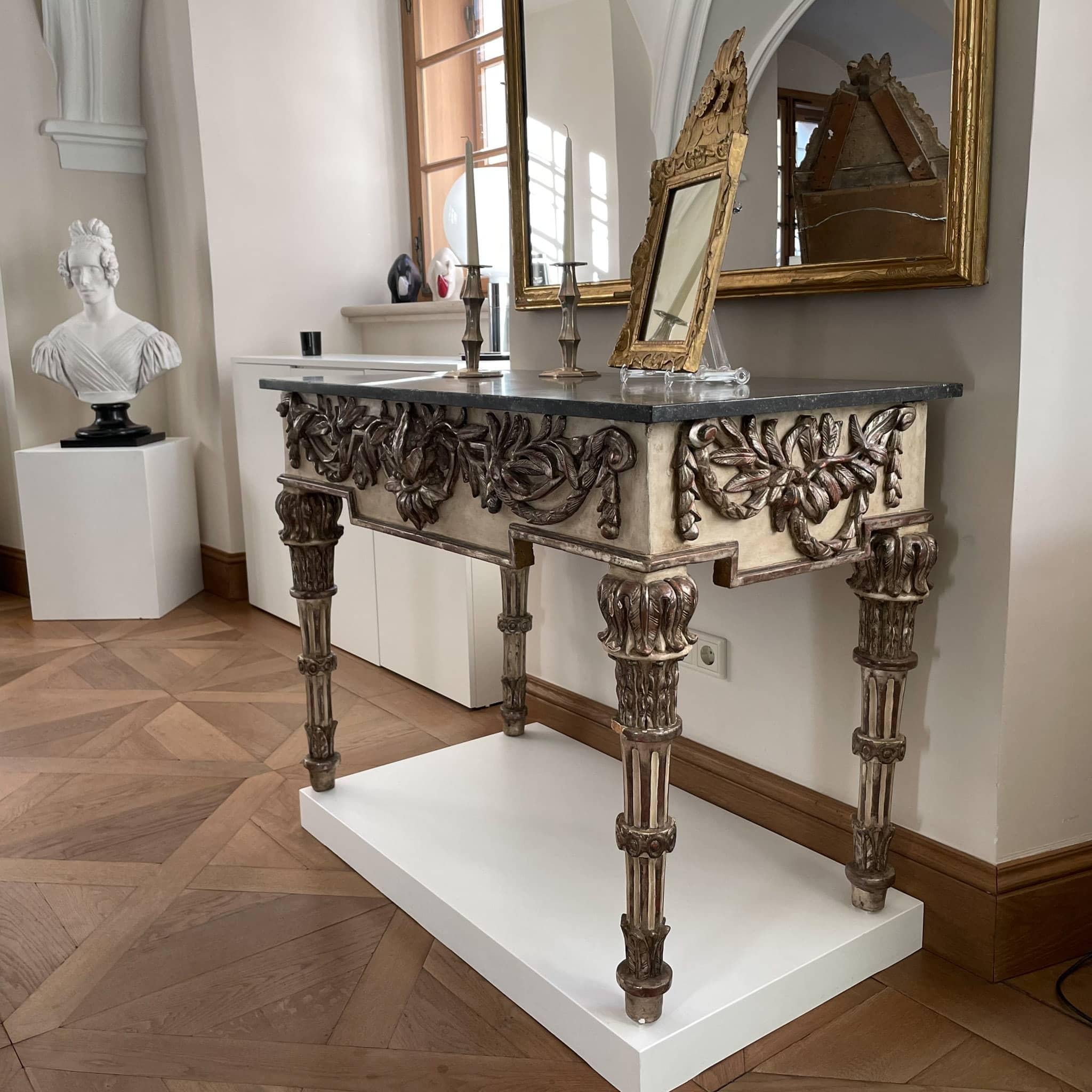 Painted and Silver patinated Console Table with Marble Top, Italian circa 1790. Exquisite Italian console table dating from the 1790s with black marble top and partly silvered legs and frame. The legs are fluted and slightly tapered, the frame is