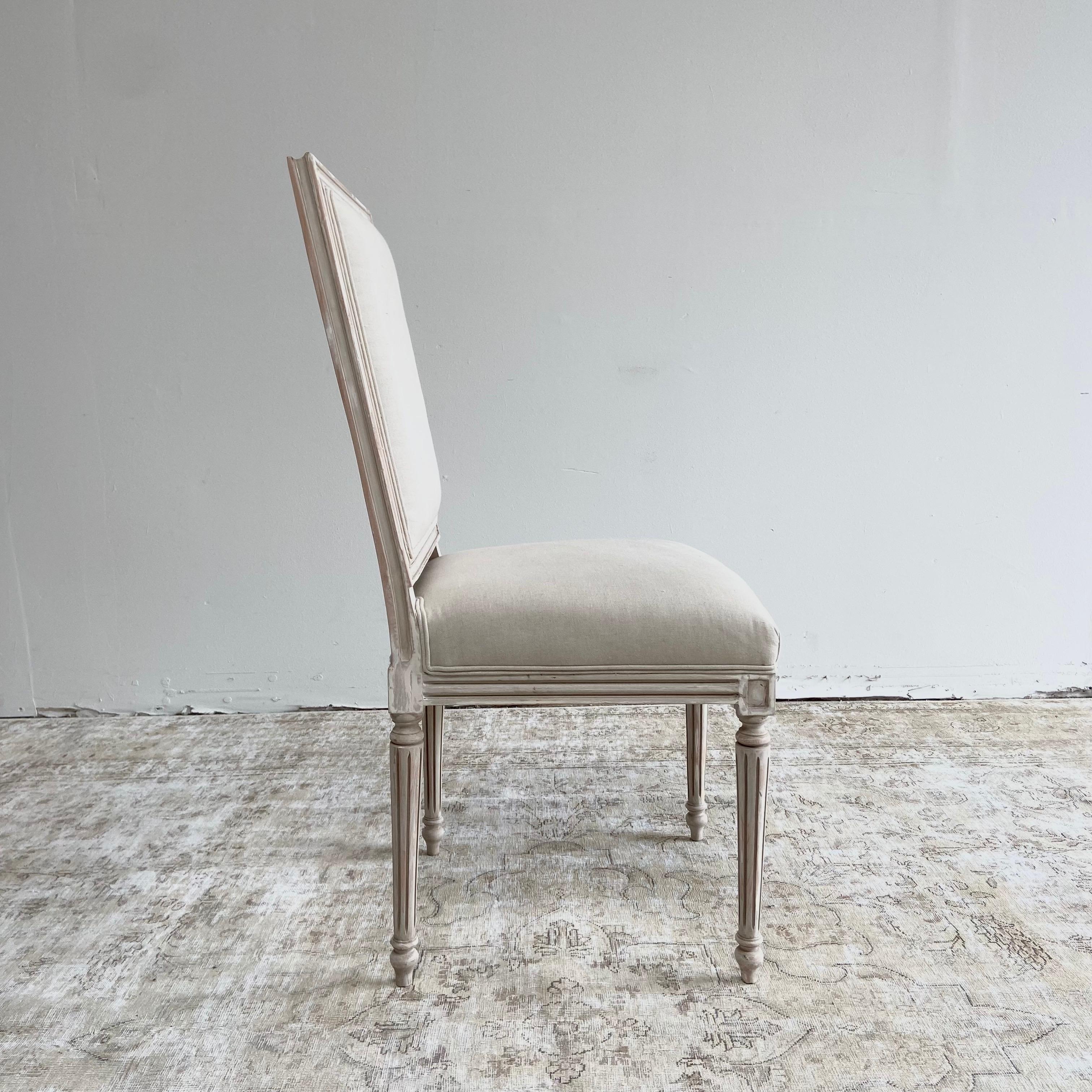 This listing includes 2 total dining chairs, in a distressed creamy white painted wood, and upholstered back and seat.
Upholstery is in a canvas cloth, can be reupholstered by us at an additional fee, we offer linen, leather, and other types of