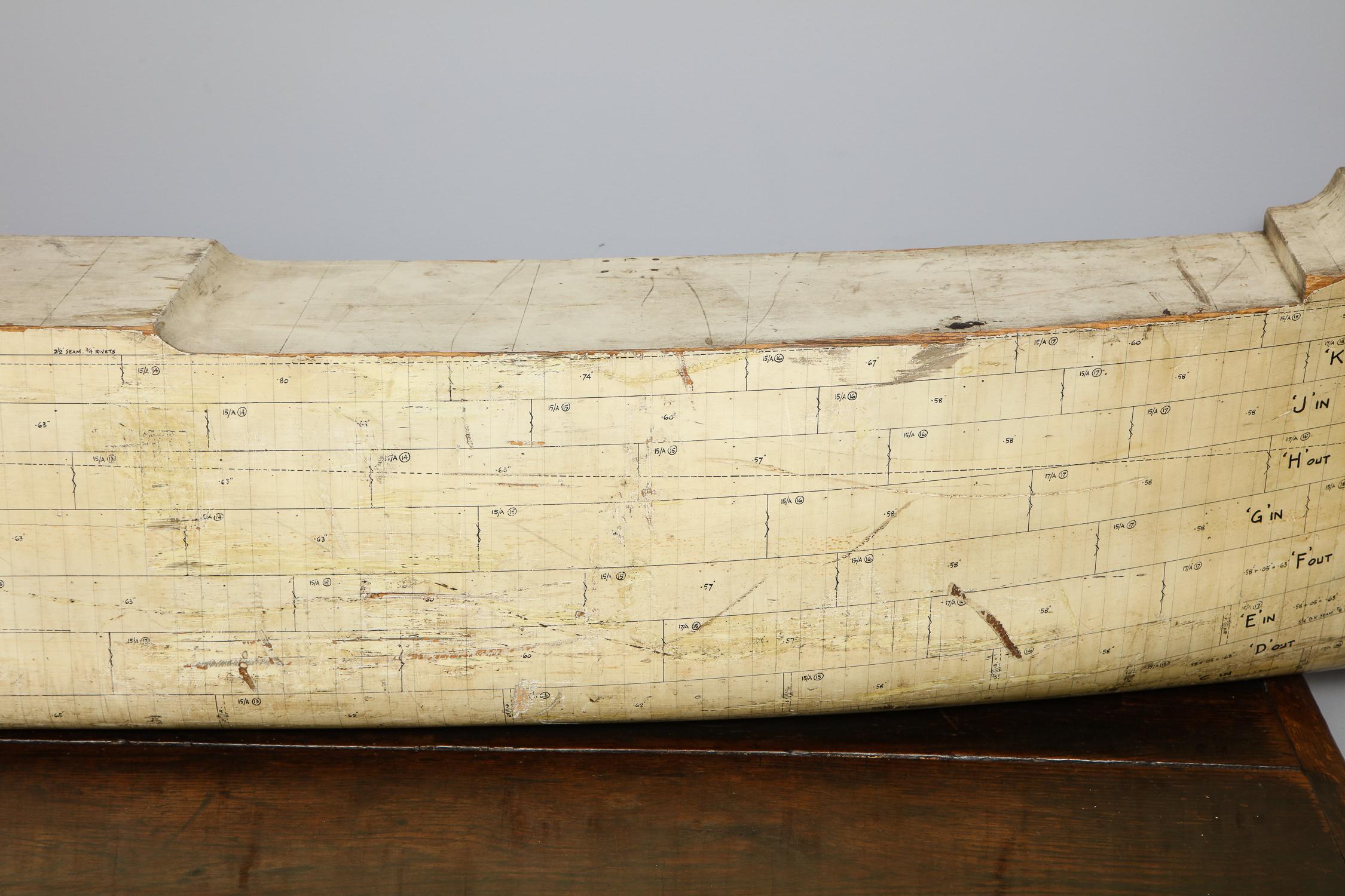 Rare American 1930s ship’s half hull model of impressive scale, annotated with construction details and in original white painted surface with black measured demarcations depicting details of steel sections from which the ship was to be constructed.