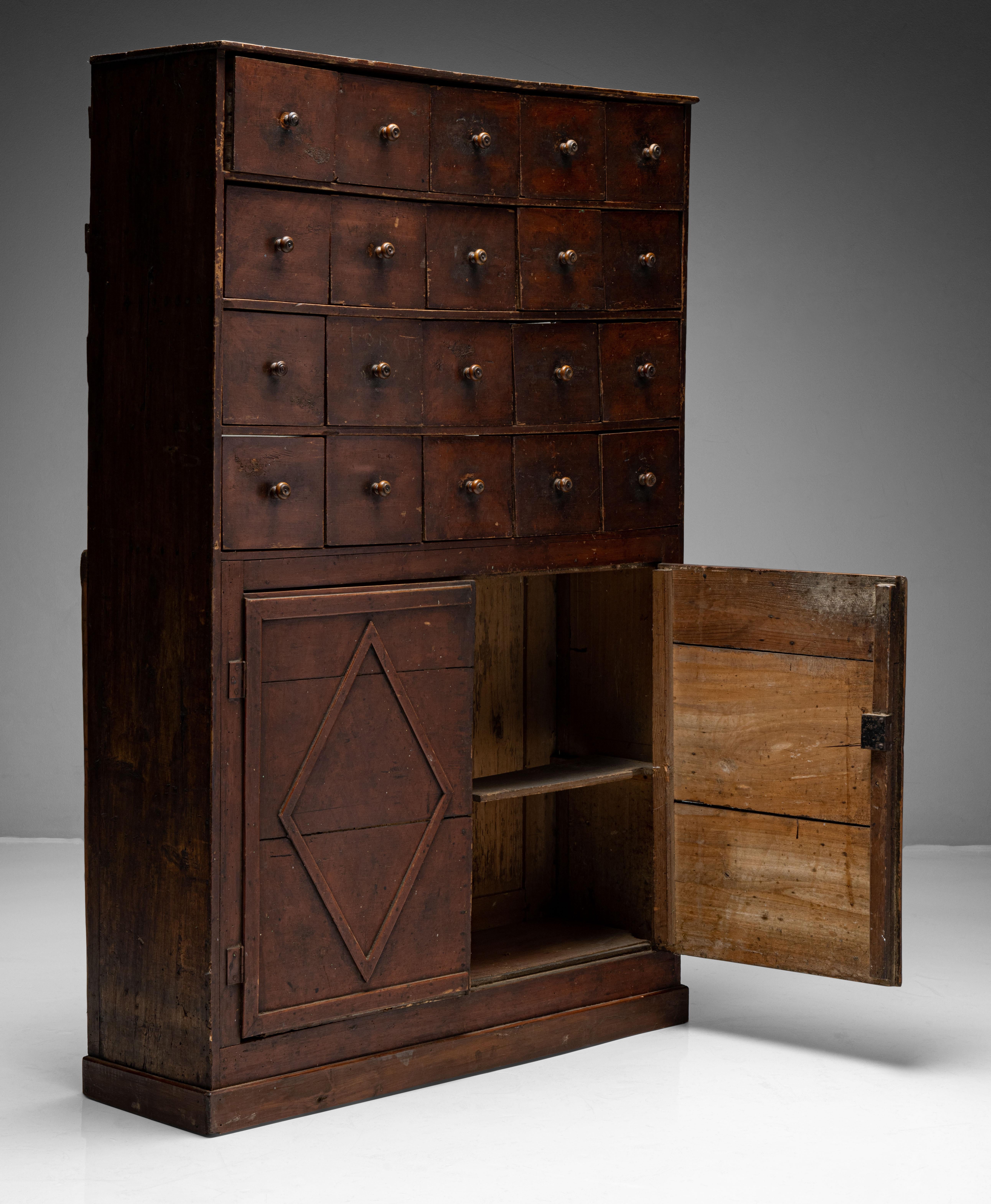 Painted Apothecary cabinet

England, Circa 1850

Pine cabinet in original painted finish with twenty drawers on top and cabinet below.