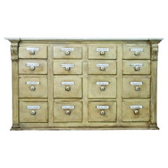 Painted Bank of Drawers with a marble top and enamel name plates