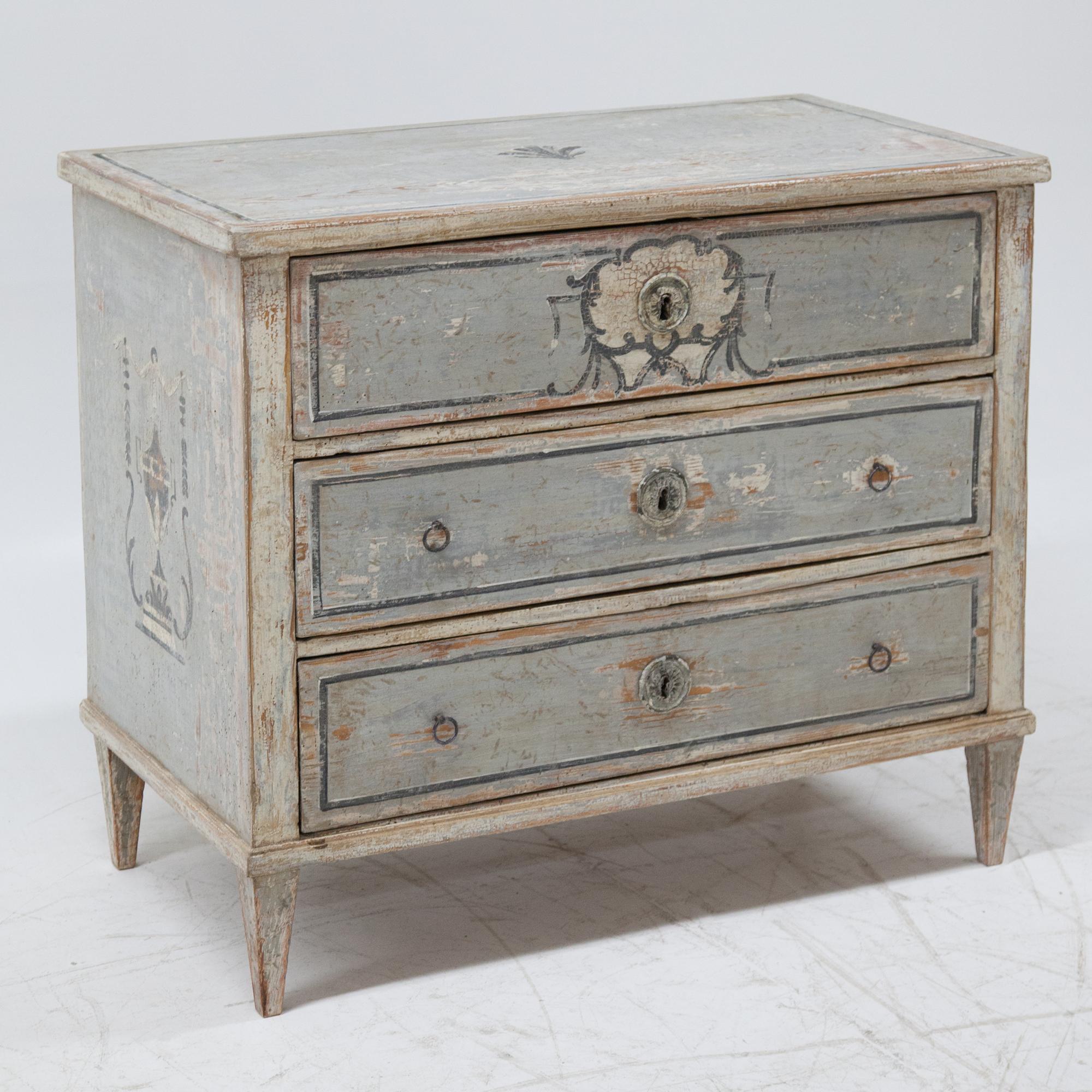 Biedermeier chest of drawers with three drawers on square pointed feet with a new, light blue paint with dark blue accents and a distressed patina.