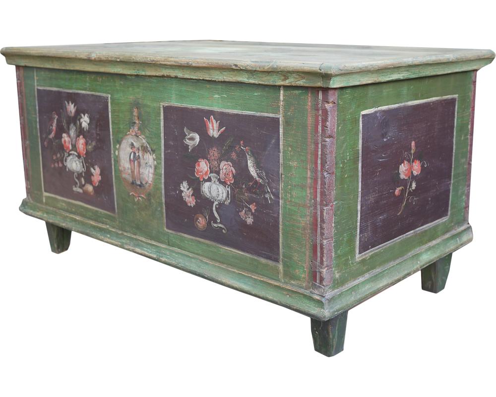 Measures: H.67cm - W.122cm - D.68cm
H.25.4 in – W.48 in – D. 26.8 in

Tyrolean painted chest, not yet restored. Entirely painted green, it has two panels on the front containing cups of flowers and apotropaic symbols. In the center a cameo with a